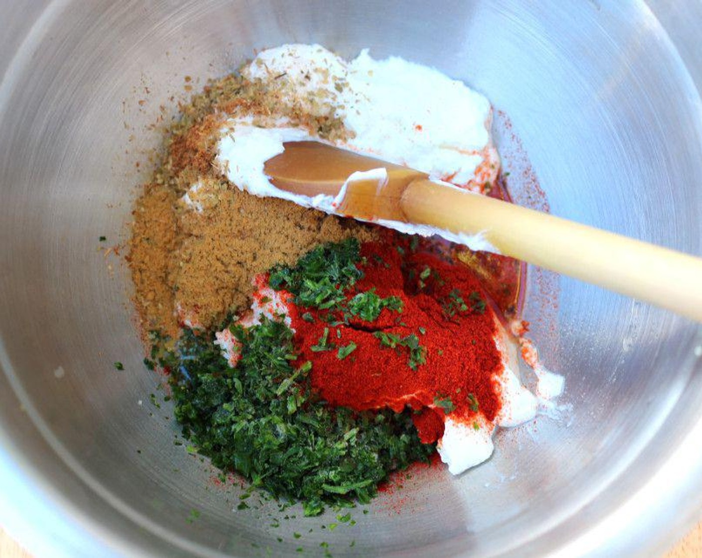 step 1 Mix together Olive Oil (2 Tbsp), zest and juice from Lemon (1), Garlic Paste (2 Tbsp), Sweet Paprika (1 Tbsp), Kosher Salt (2 Tbsp), Crushed Red Pepper Flakes (1/2 tsp), Ground Coriander (1 Tbsp), Fresh Oregano (1 Tbsp), Ground Cumin (1 tsp), Fresh Cilantro (2 Tbsp), and Greek Yogurt (3 cups).