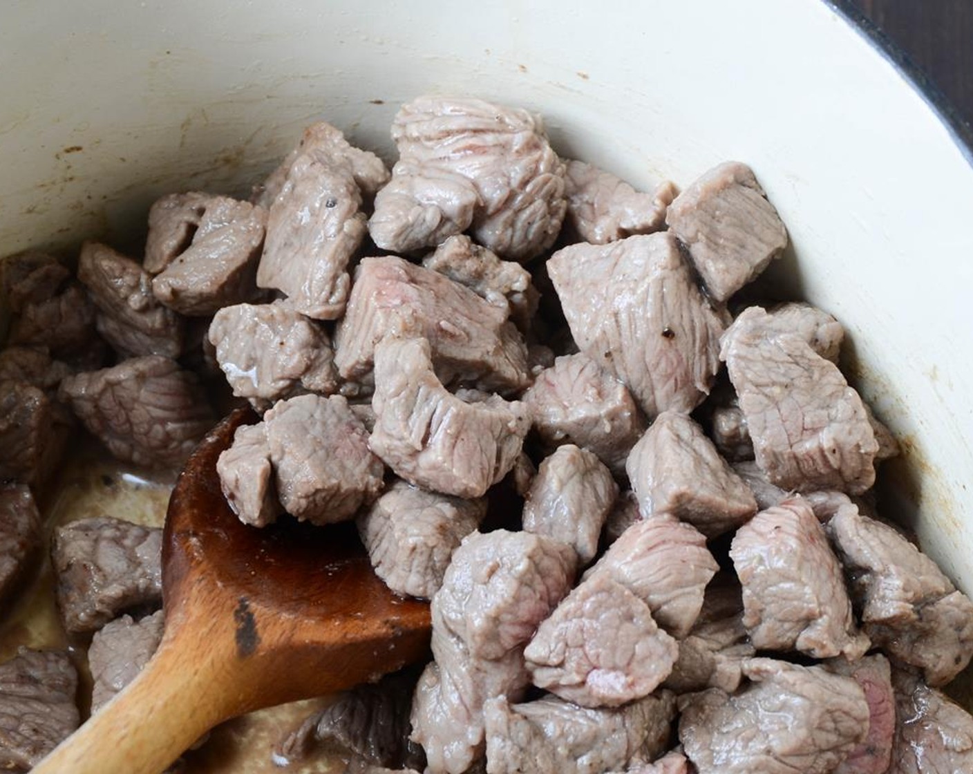 step 3 Heat additional Olive Oil (1 Tbsp) in the pot and add the Beef Chuck (1.3 lb). Sprinkle with Salt (to taste) and Ground Black Pepper (to taste). Cook, stirring occasionally until browned, about 5 minutes.