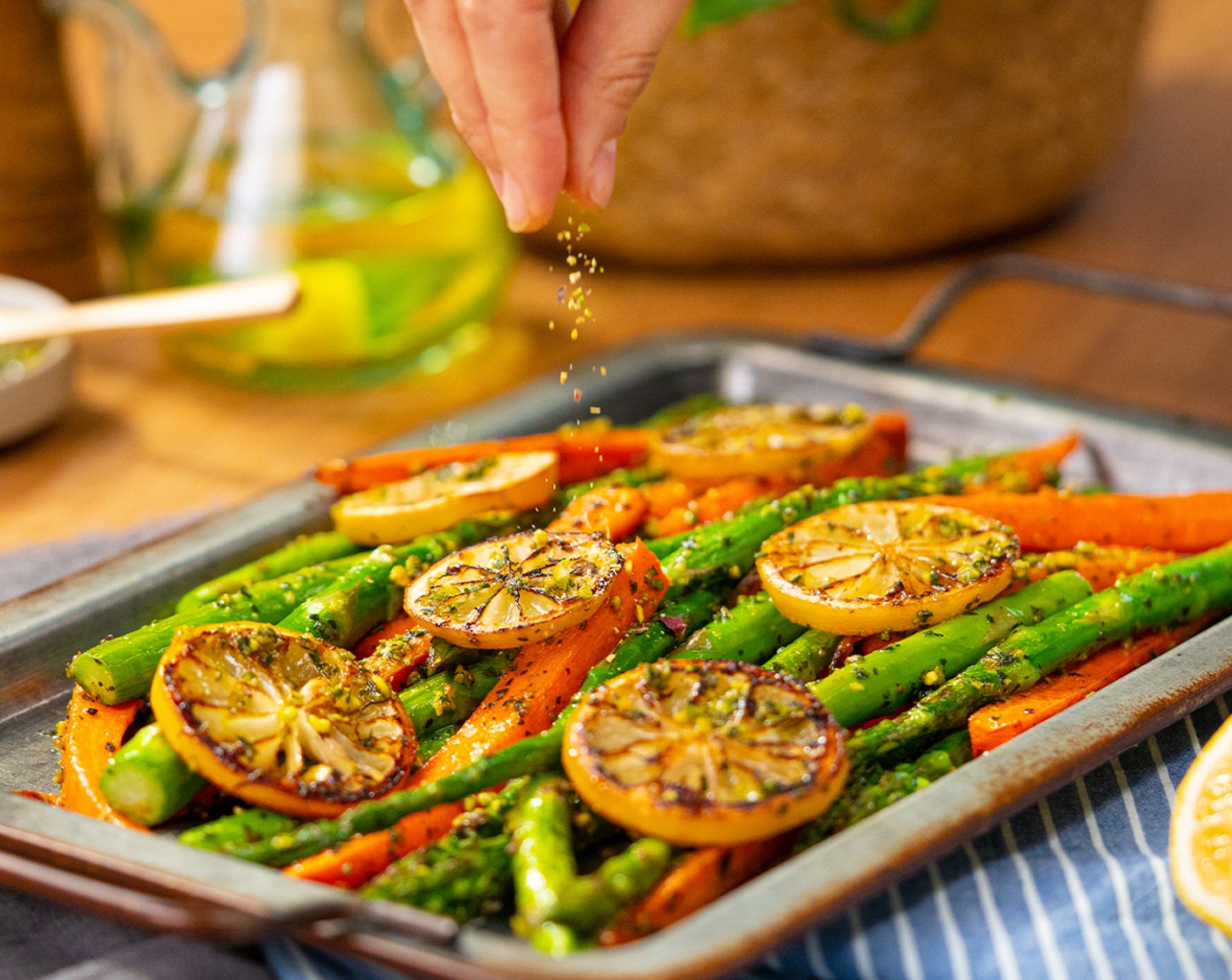 step 6 Toss the pesto with the vegetables. Sprinkle with remaining chopped pistachios and serve.