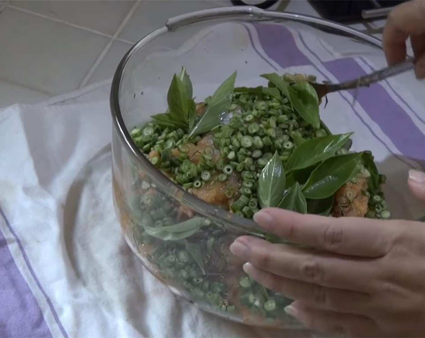 step 2 Into a bowl, mix the tilapia, Fish Sauce (1/2 Tbsp), Granulated Sugar (1 Tbsp), Green Beans (1 cup), Kaffir Lime Leaves (2 Tbsp), and Fresh Thai Basil Leaves (1 cup). The fish has to be wet. If on the dry side mix in the Egg (1).