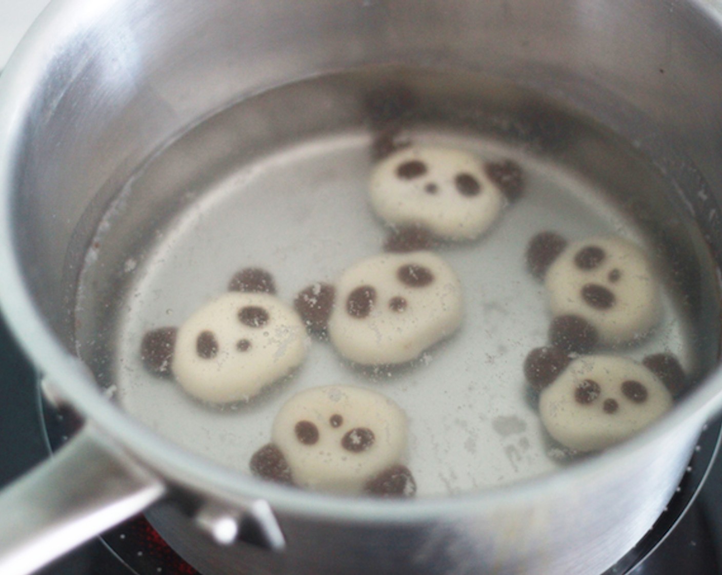 step 9 Boil the pandas! Toss the pandas gentry in a boiling water with a low heat, and cook them till they float. It should take around 5 minutes. Pick up the floating pandas. When pandas start to float, it’s time to eat!