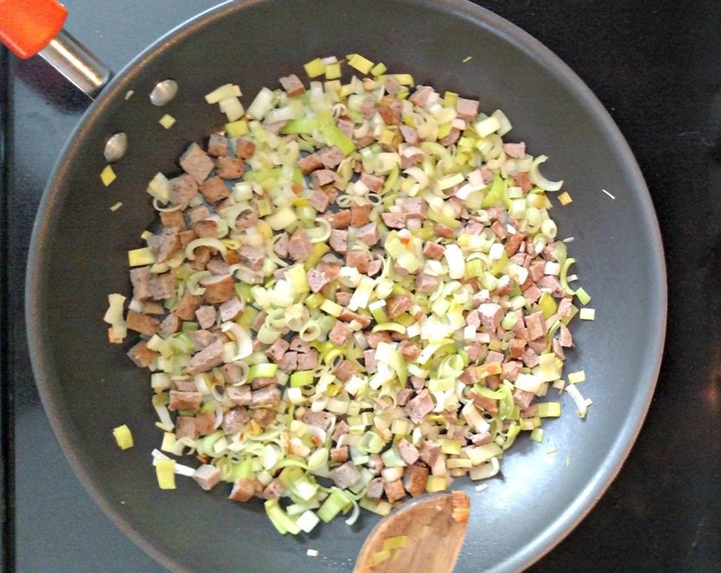 step 4 Add sausage and saute together for another 2 to 3 minutes over medium-low heat.