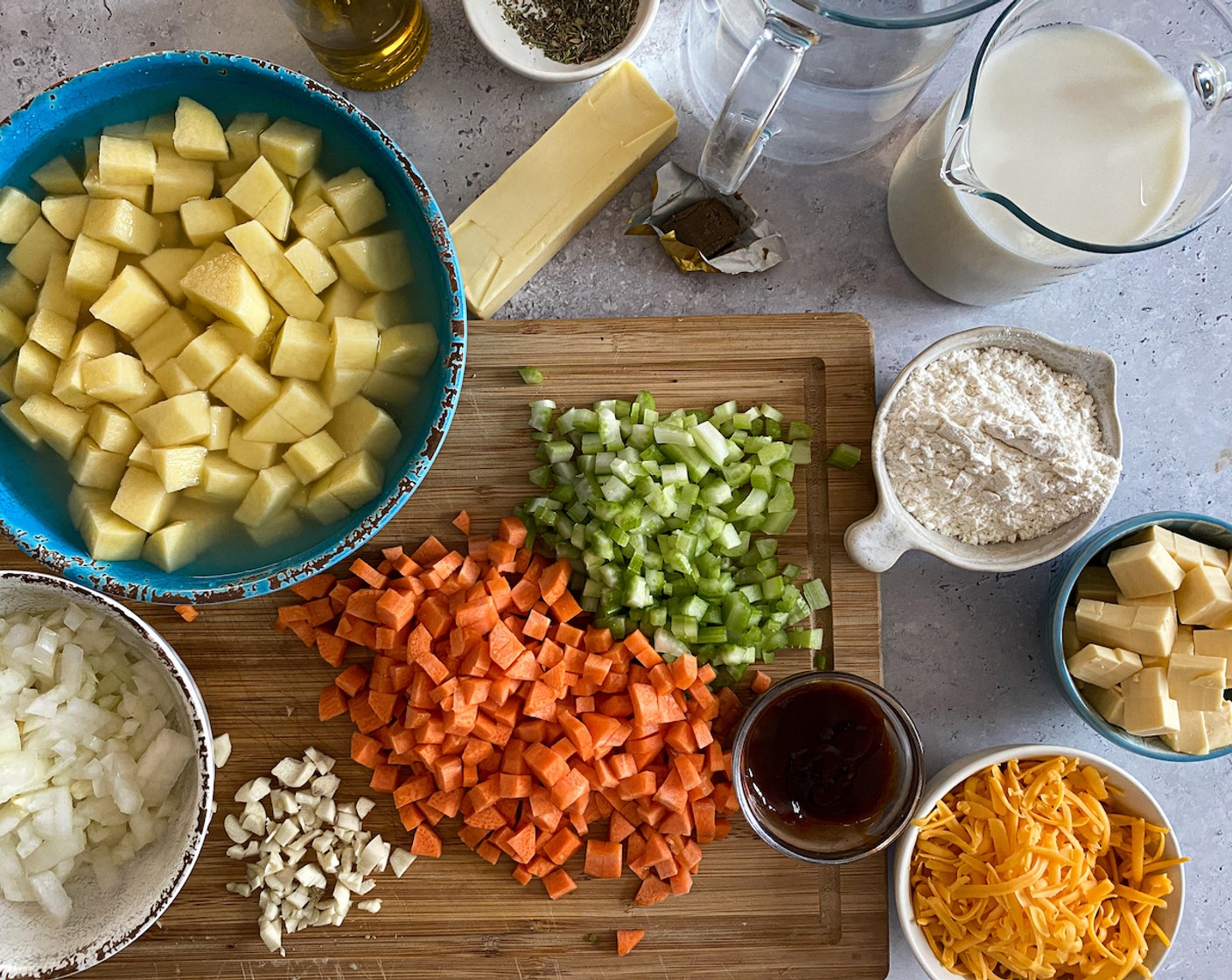 step 2 Peel and dice Potatoes (2) into 1/2-inch cubes. Finely dice the Onion (1), Celery (2 stalks), Carrots (3), and Garlic (3 cloves). Dice the Monterey Jack Cheese (3/4 cup) into 1/4-inch cubes or grate it.