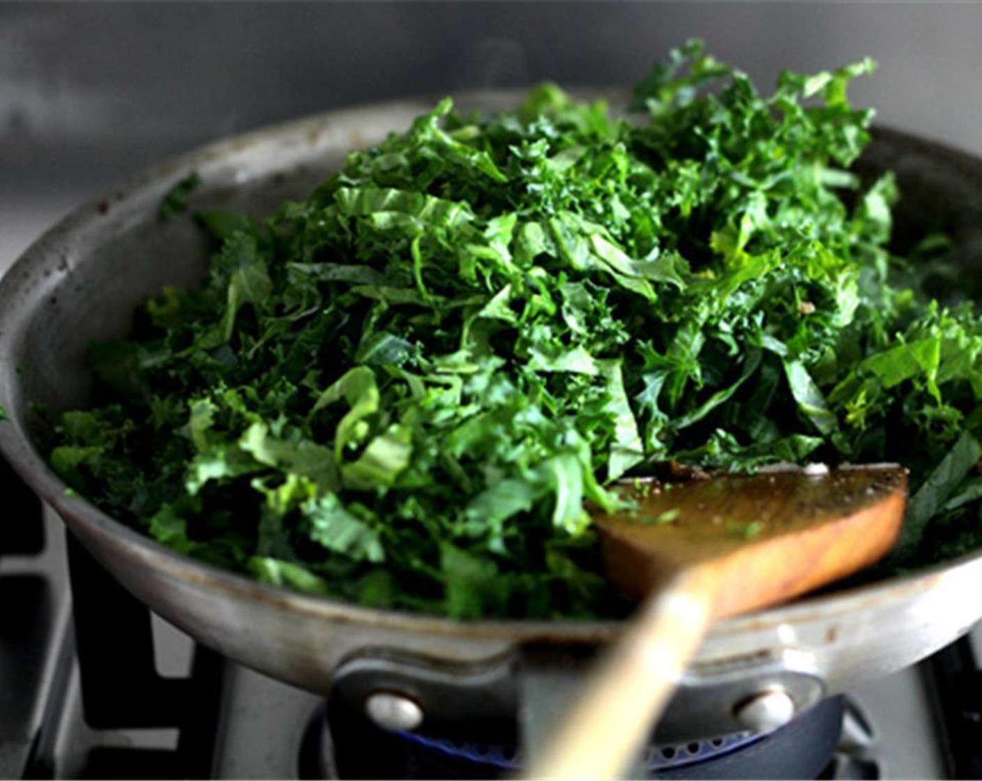 step 19 Add the sliced kale leaves, season again with salt and ground black pepper, and cook until slightly wilted. Add Green Peas (1/4 cup), reserved mushroom water, and Chicken Stock (1/3 cup).