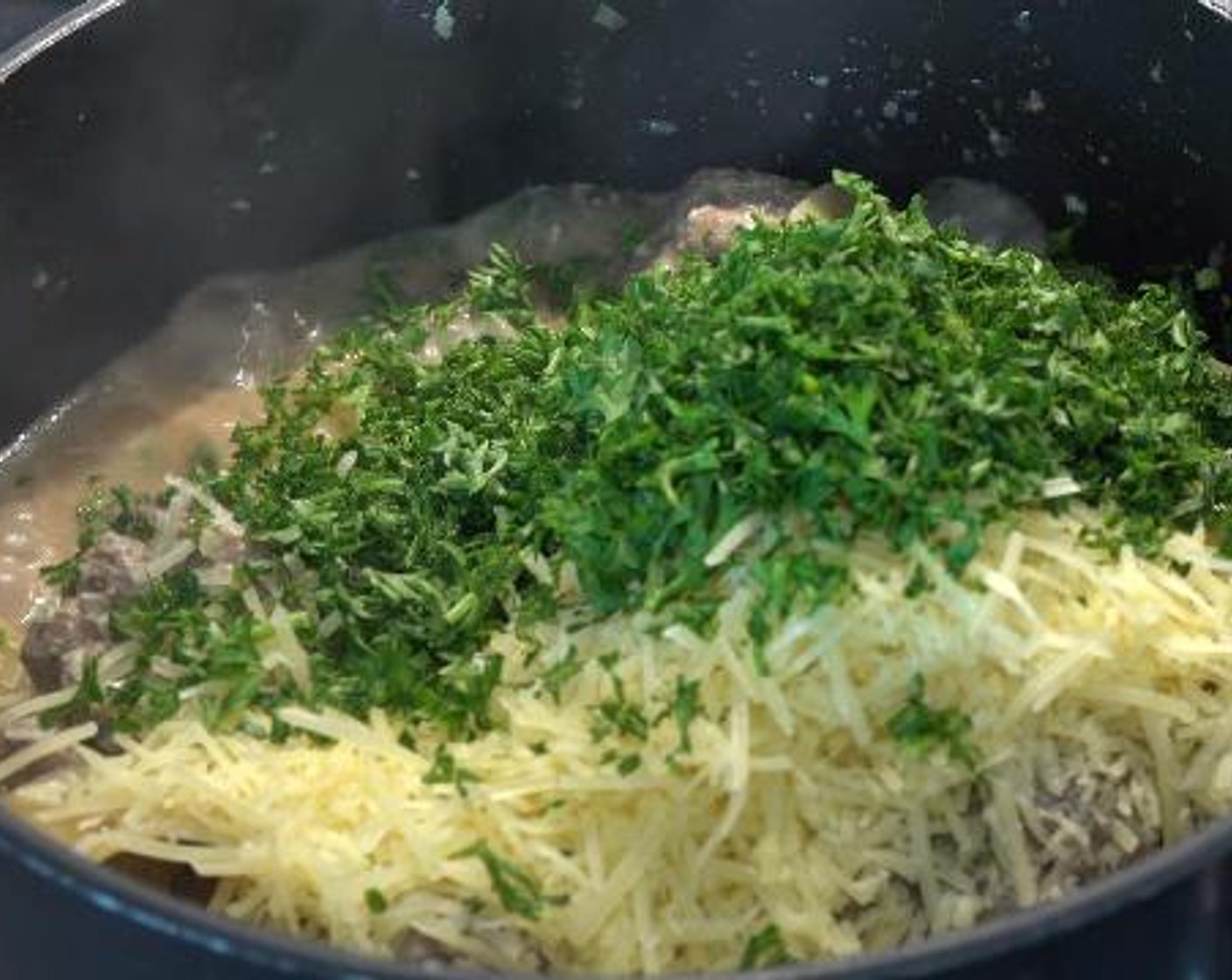 step 5 Once the pasta is well cooked, add the Parmesan Cheese (1 cup) and Fresh Parsley (1/2 cup). Give the mixture a gentle stir.