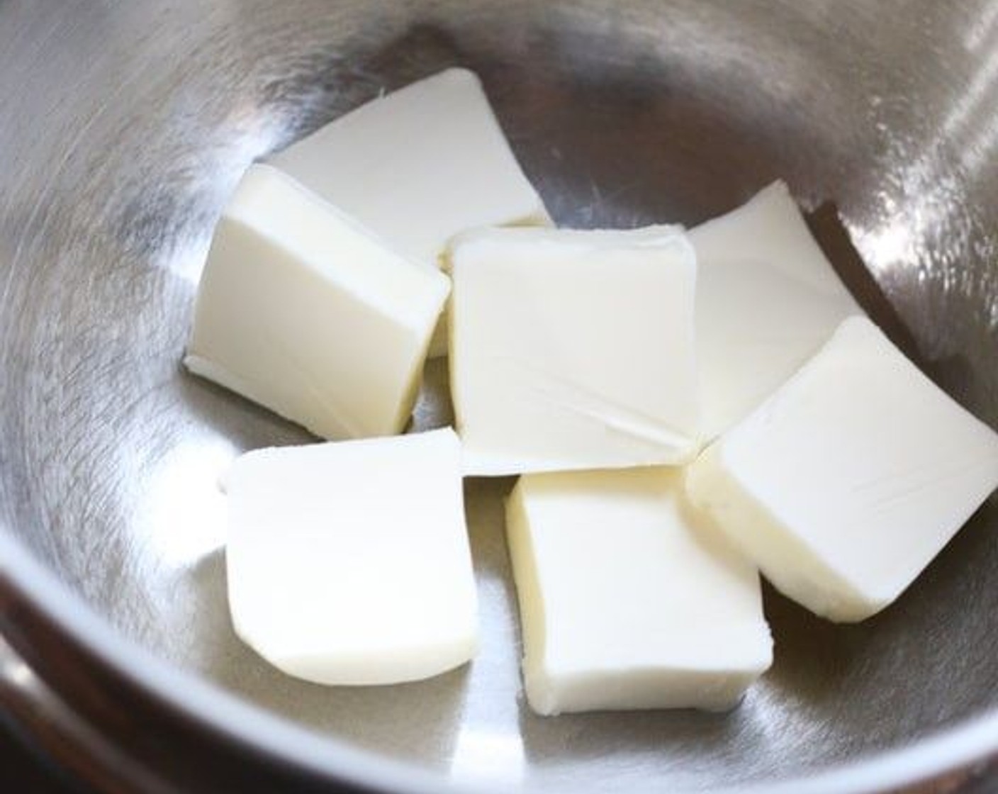 step 17 While crust is baking, melt the Unsalted Butter (1/3 cup) in the top of a double boiler, with barely one inch of water in the lower pan, maintained at just below a simmer – make sure that water does not touch the bottom of the bowl.