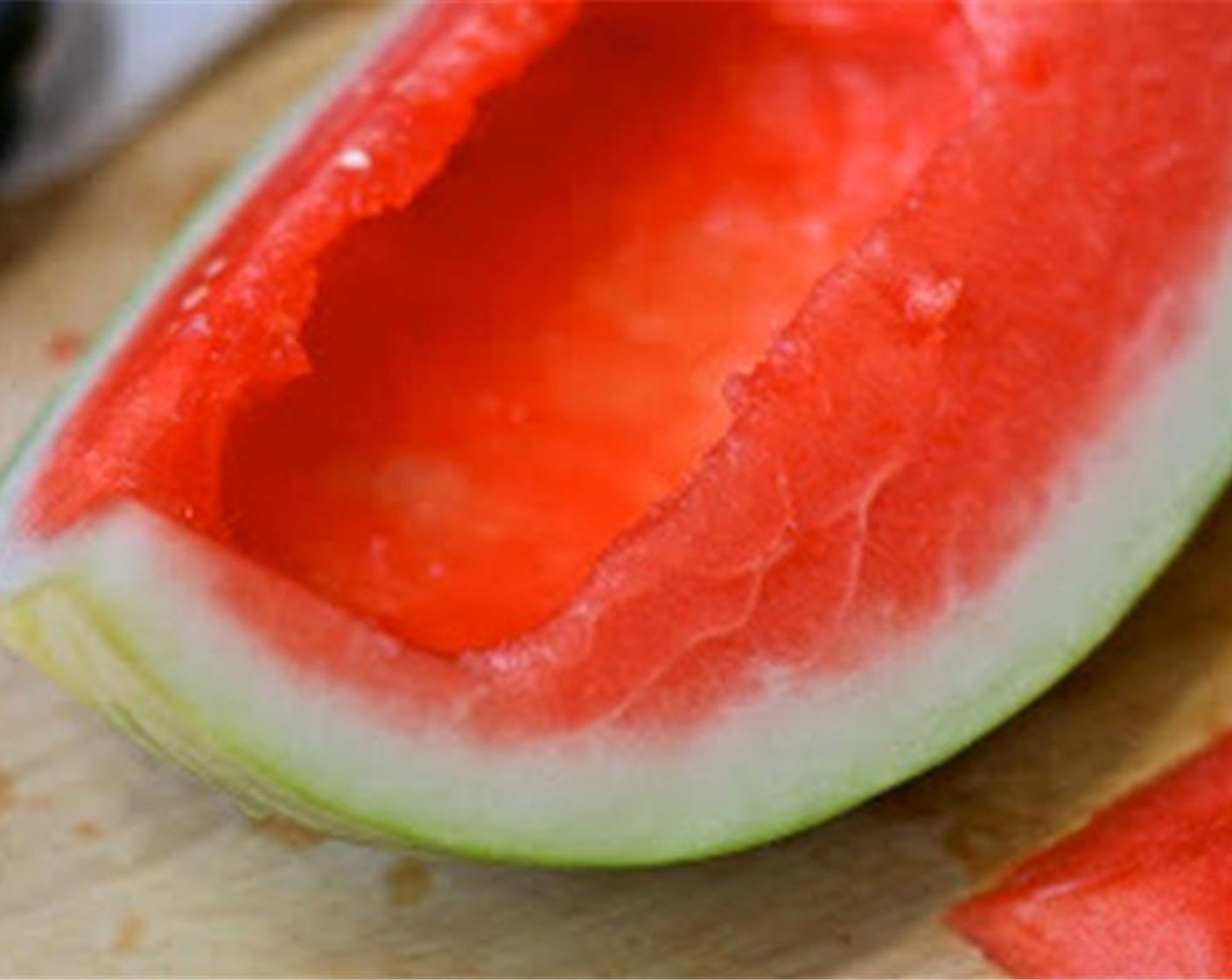 step 1 Carefully hollow out the Watermelon (1/4) to create a "boat" to hold jello mixture.