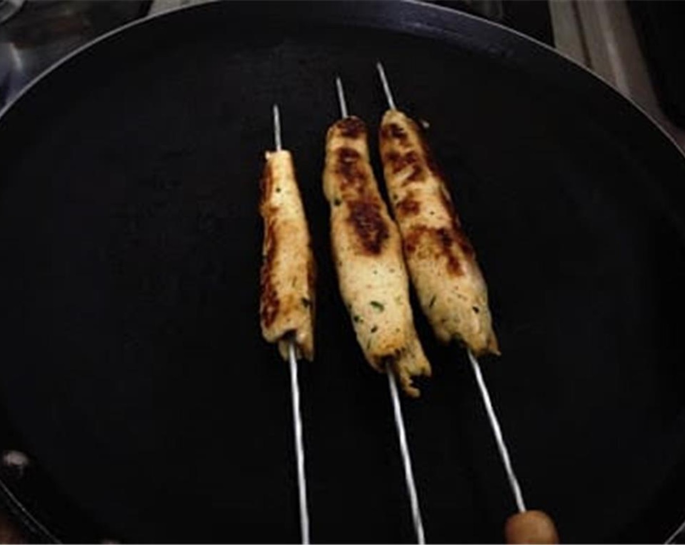 step 5 Now, put some oil on the pan or tawa and place the kebab over it. Keep rotating it so that all the sides are cooked nicely. Cook till it becomes golden brown on all sides.