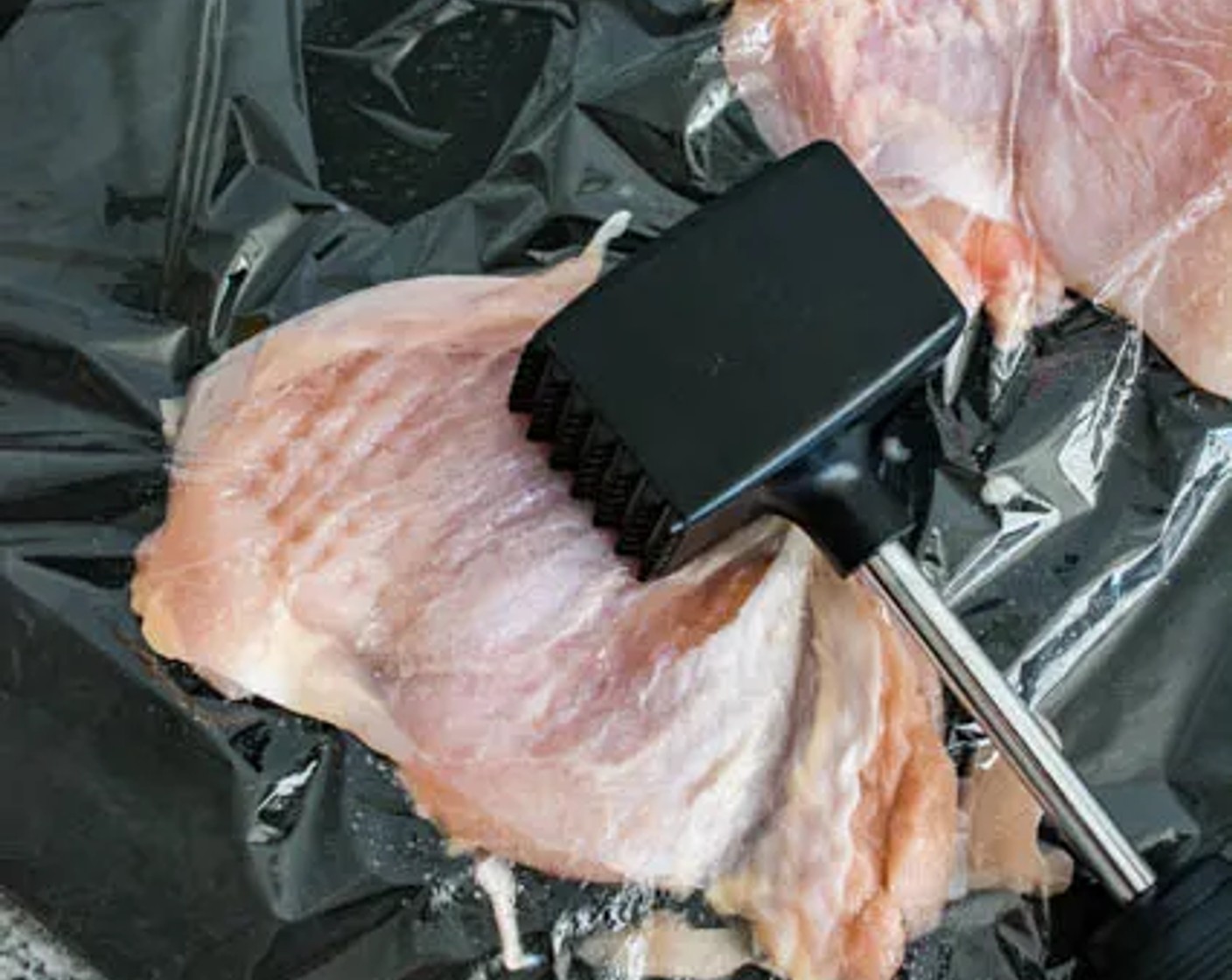 step 1 Place the Boneless, Skinless Chicken Thighs (1.5 lb) on a large cutting board, cover with plastic wrap, then pound with a meat tenderizer till the chicken is at approximately 1/2-inch thickness.