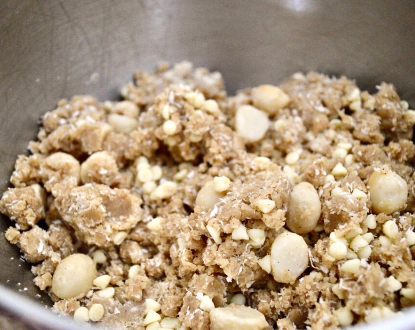 step 6 Turn off the mixer and switch to a spatula to thoroughly fold in the White Chocolate Chips (1 cup), Macadamia Nuts (1 cup), and Unsweetened Shredded Coconut (1/2 cup). Set the bowl of dough in the refrigerator to chill for 2 hours.