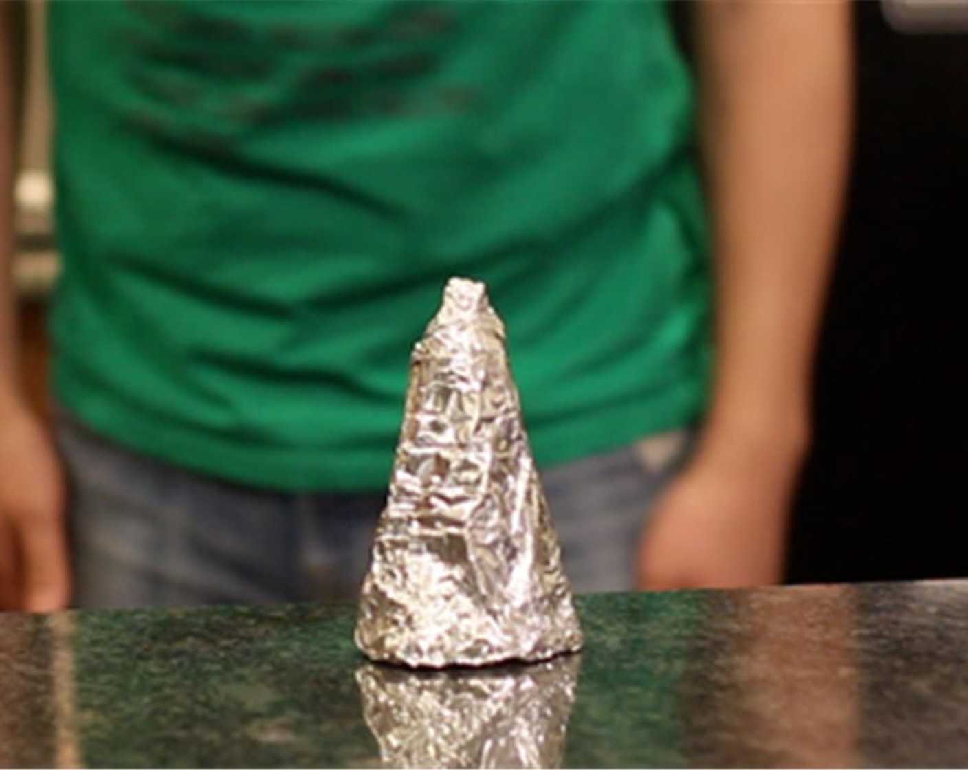 step 2 Make a cone out of tin foil.