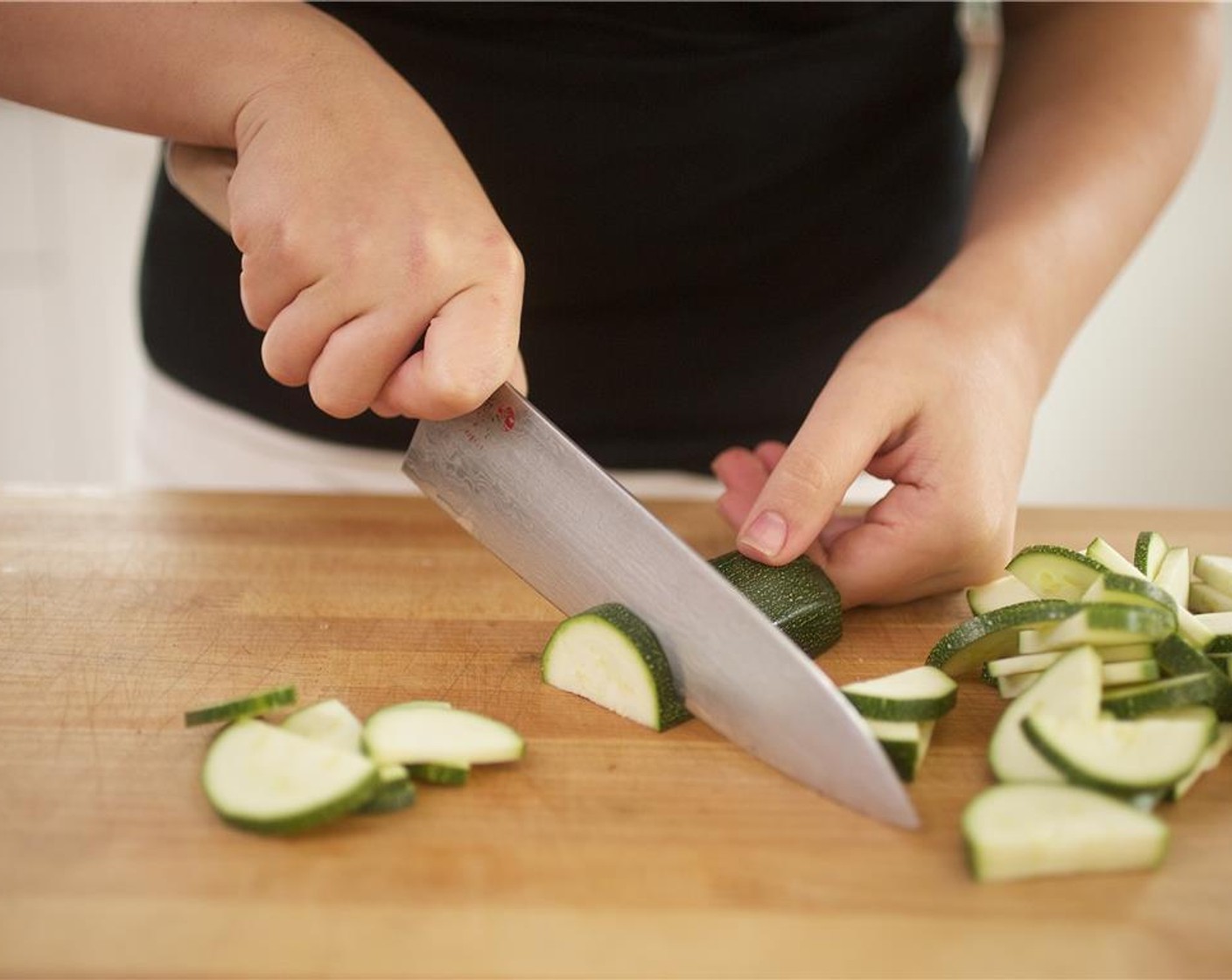 step 2 Cut only half of the Cherry Tomato (1/2 cup) in half. Slice Zucchini (1/2) in half lengthwise then slice across into half moons. Set aside.