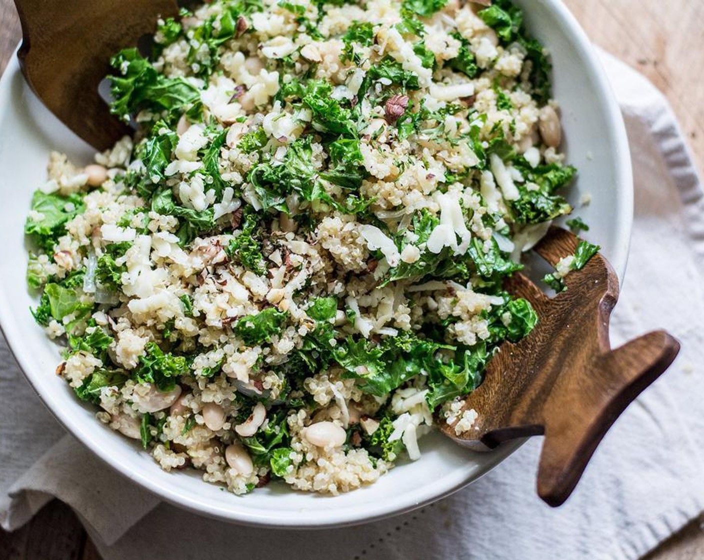 step 5 Add the cooked onions, garlic and kale to the quinoa mixture, toss in the Hazelnuts (1/4 cup) and stir until all ingredients are well mixed. Serve and enjoy immediately, while the salad is still warm.