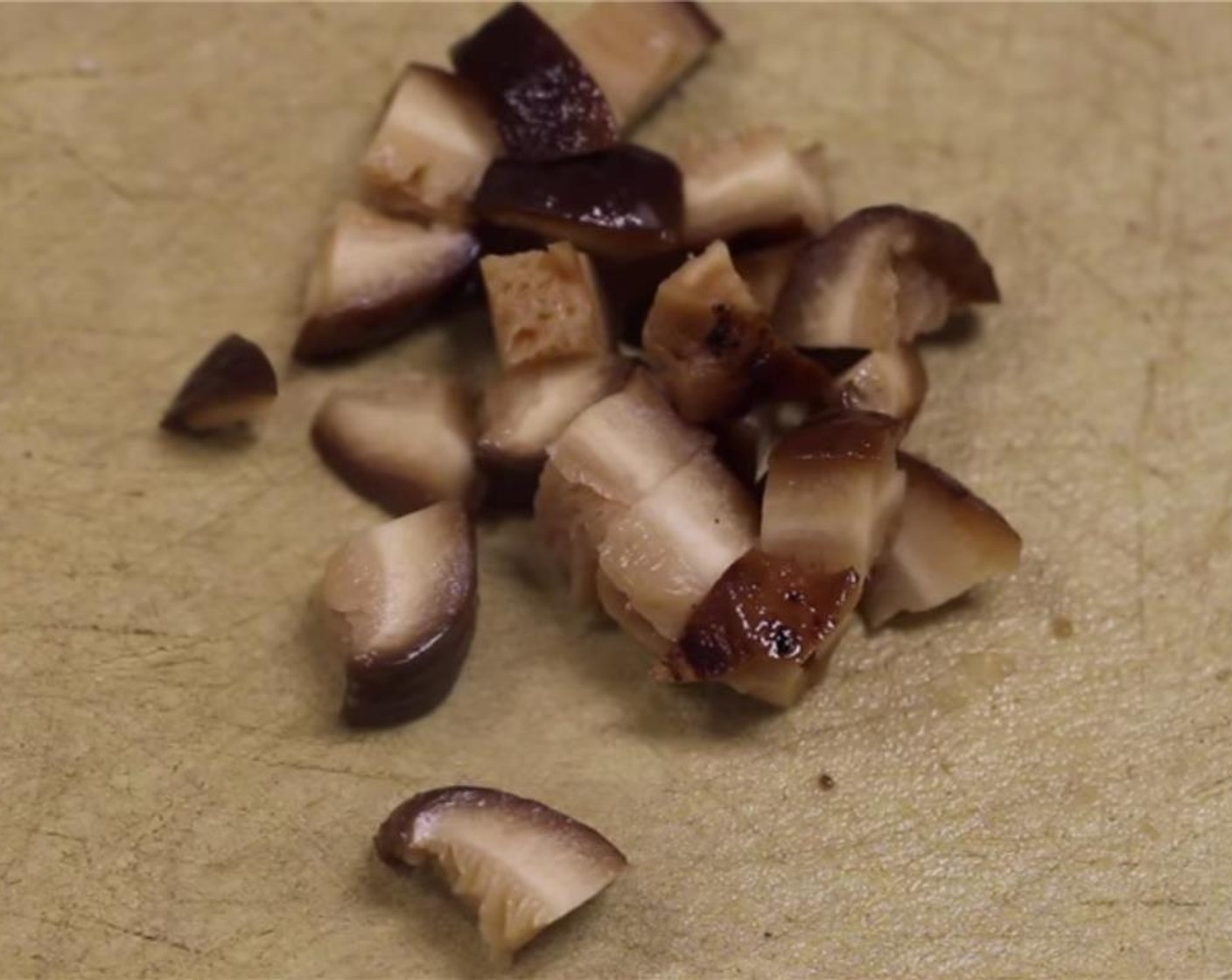 step 7 Squeeze excess liquid from the shitake mushrooms and cut into fine pieces.