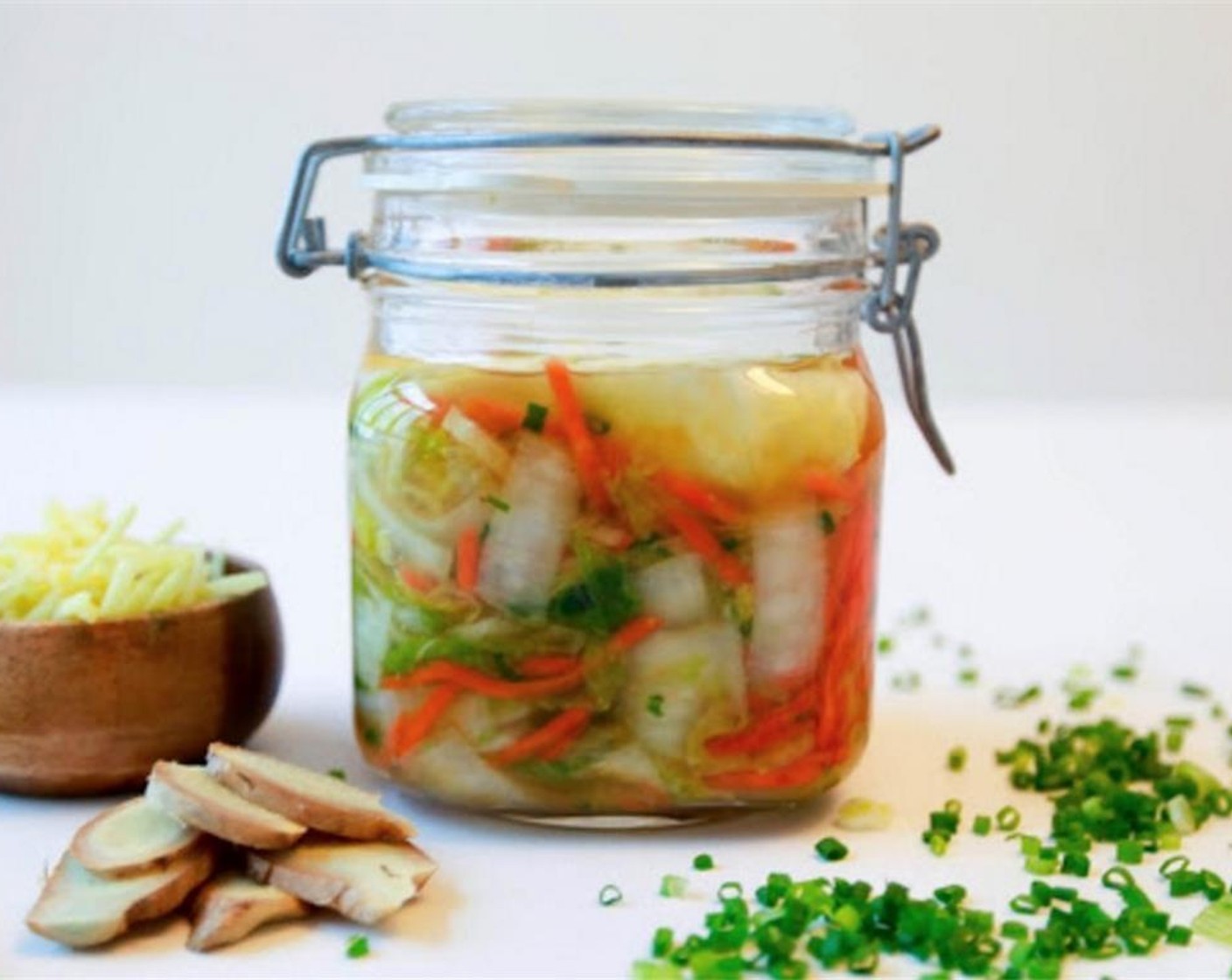 step 8 Place the kim chi mixture into the glass jar, packing down really well with your fist. Add all of the juices from the mixing bowl. Pack the vegetables down hard again to ensure all the air bubbles are released.