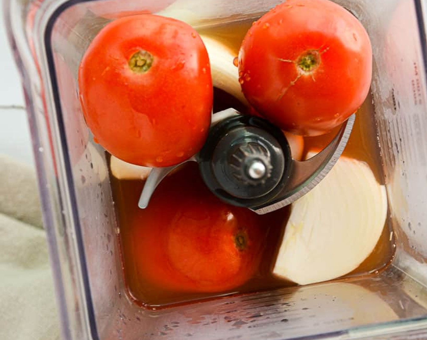 step 2 While toasting the rice, make the tomato broth. Add the Roma Tomatoes (2), White Onion (1/4), Low-Sodium Vegetable Stock (2 cups), and Garlic Salt (1 tsp) into the blender. Blend until smooth – about 25 seconds.