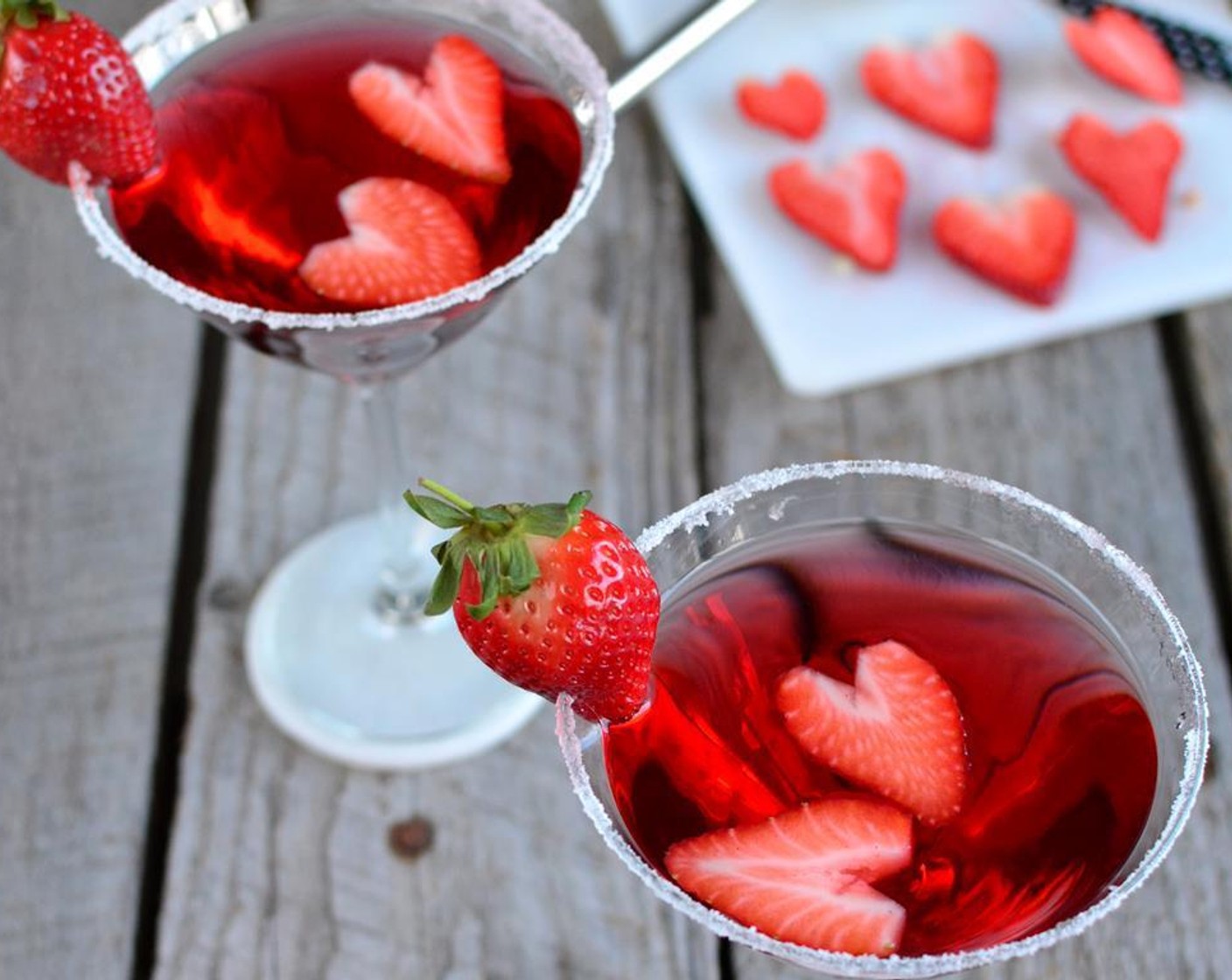 step 6 Garnish your love martini with a couple strawberry hearts and a strawberry on the rim! Enjoy!