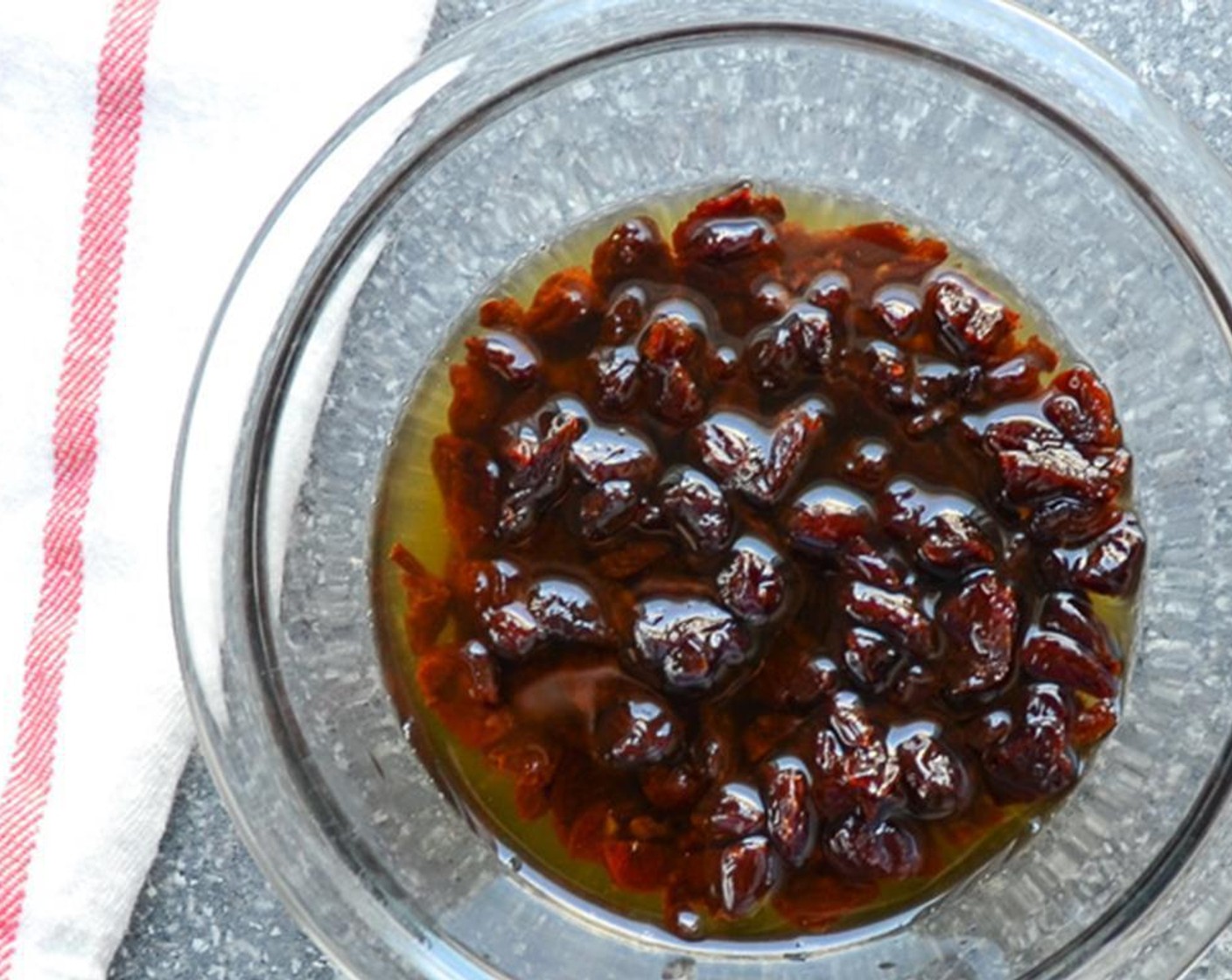 step 1 Roughly chop the Dried Tart Cherry (1 cup). Combine the cherries and Amaretto (4 Tbsp) in a small bowl and set aside for one hour to plump.