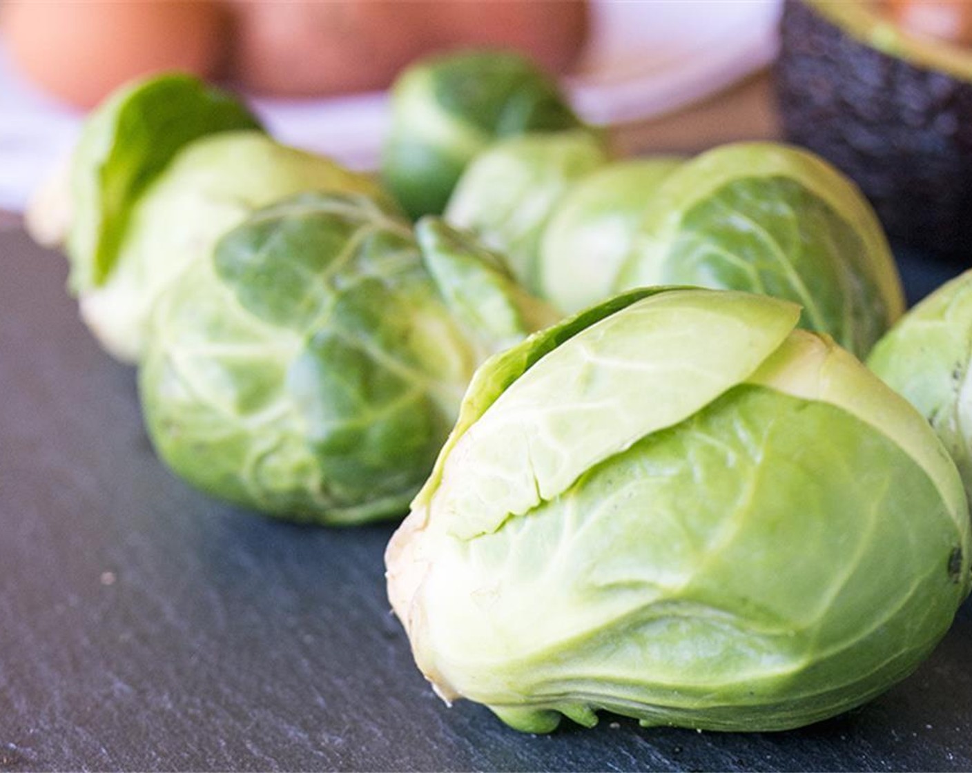 step 6 Meanwhile, add Brussels Sprouts (8) to other prepared pan, spray with Coconut Oil Cooking Spray, season with Ground Black Pepper (to taste) and Salt (to taste), toss to coat, then roast in oven 7 minutes.