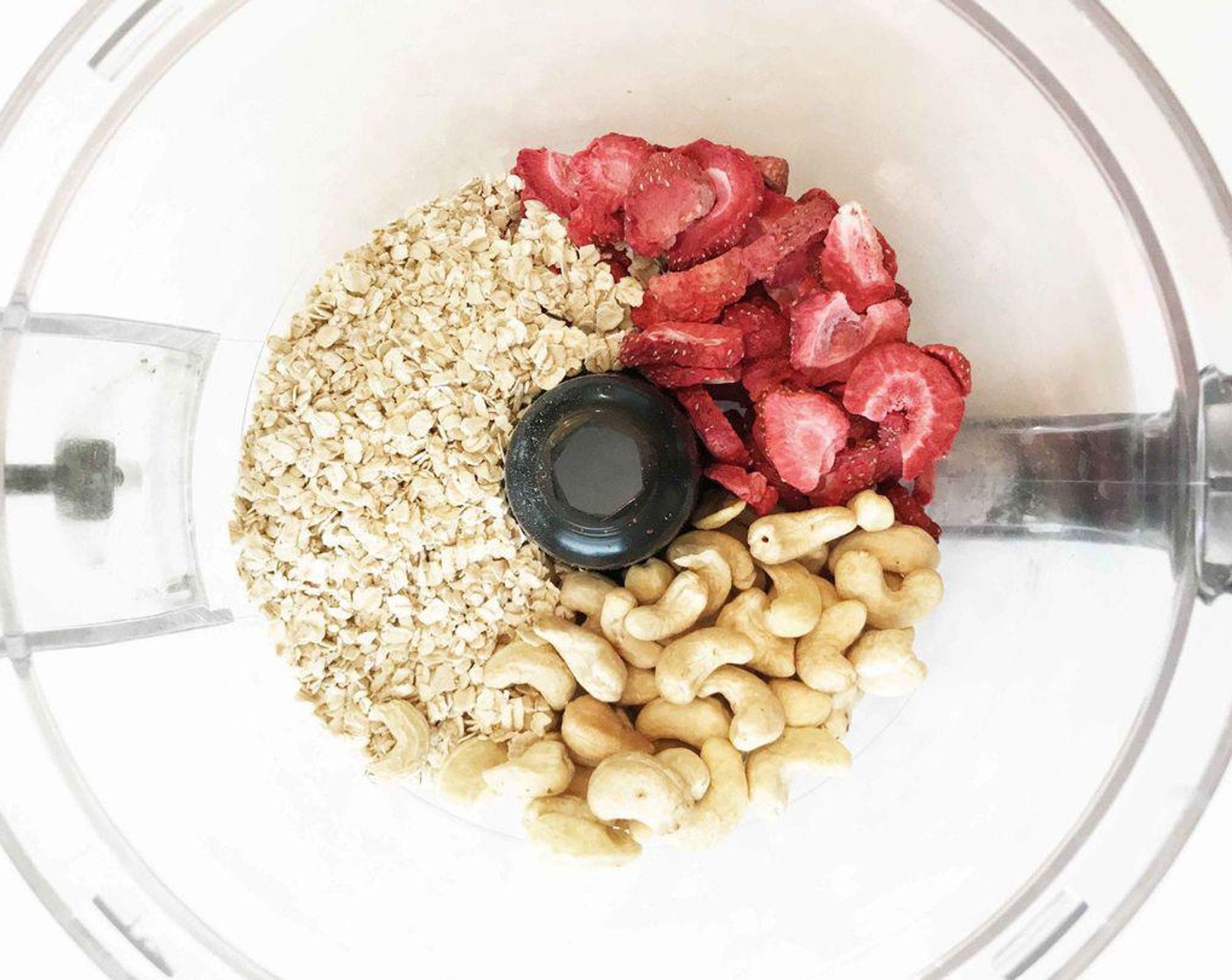 step 1 Place the Freeze Dried Strawberries (1 cup) Raw Cashews (1 cup) and Quick Cooking Oats (1 1/2 cups) into a food processor or blender.