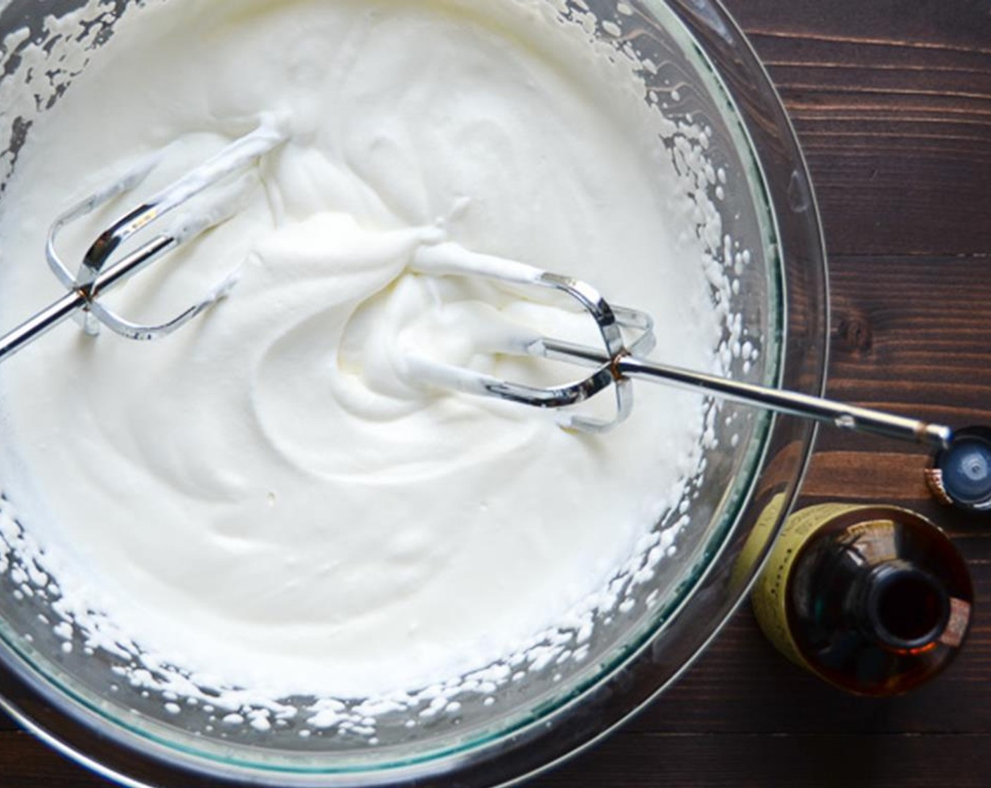 step 6 In a separate bowl, beat the Heavy Cream (1 1/2 cups) and Almond Extract (1/2 tsp).