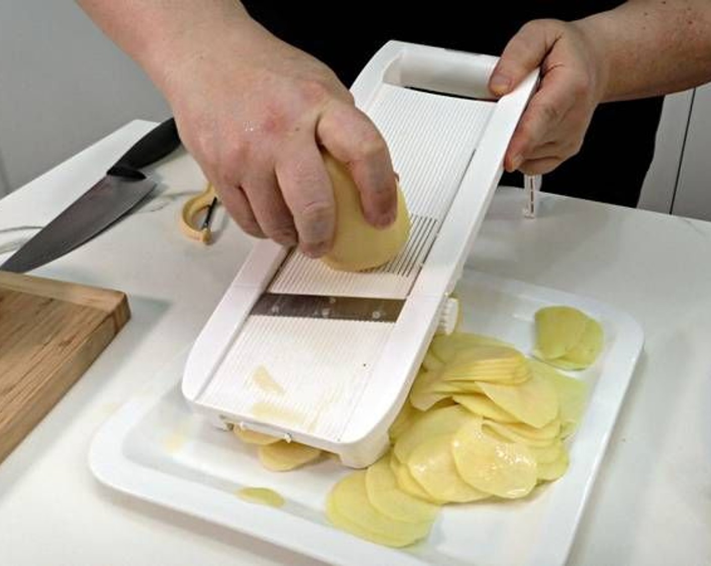 step 2 To slice the potatoes use a mandolin or slice very thinly with a knife.
