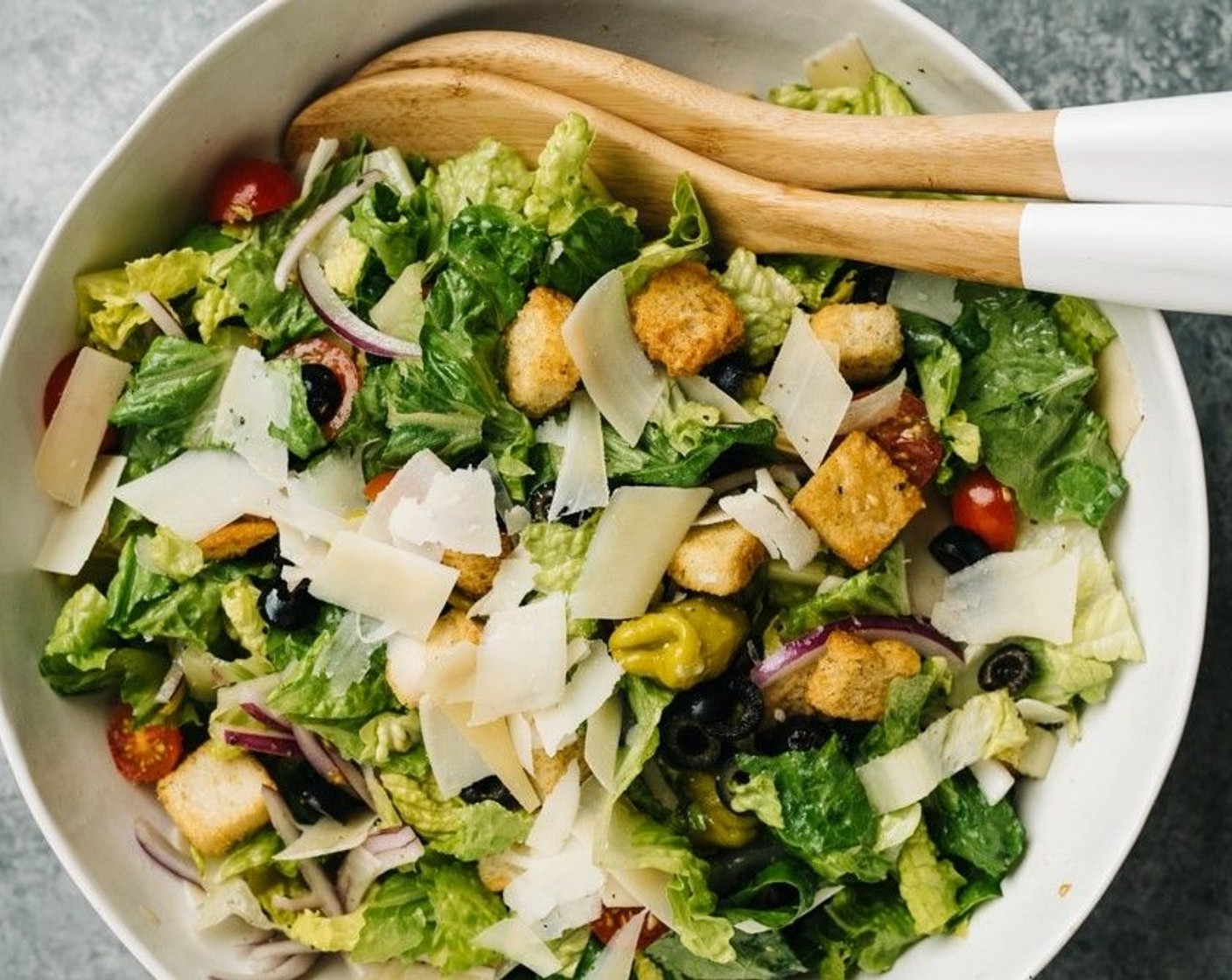 step 3 Toss to combine, drizzle with the vinaigrette and toss again to coat the salad. Serve with more Parmesan cheese sprinkled over the top.