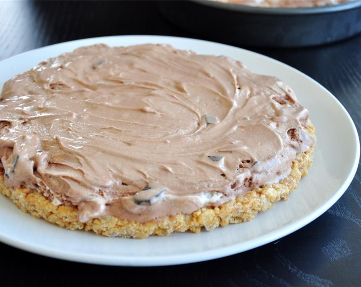 step 5 Take out the mixture from both cake pans. Spread one side with Ice Cream (3 cups).