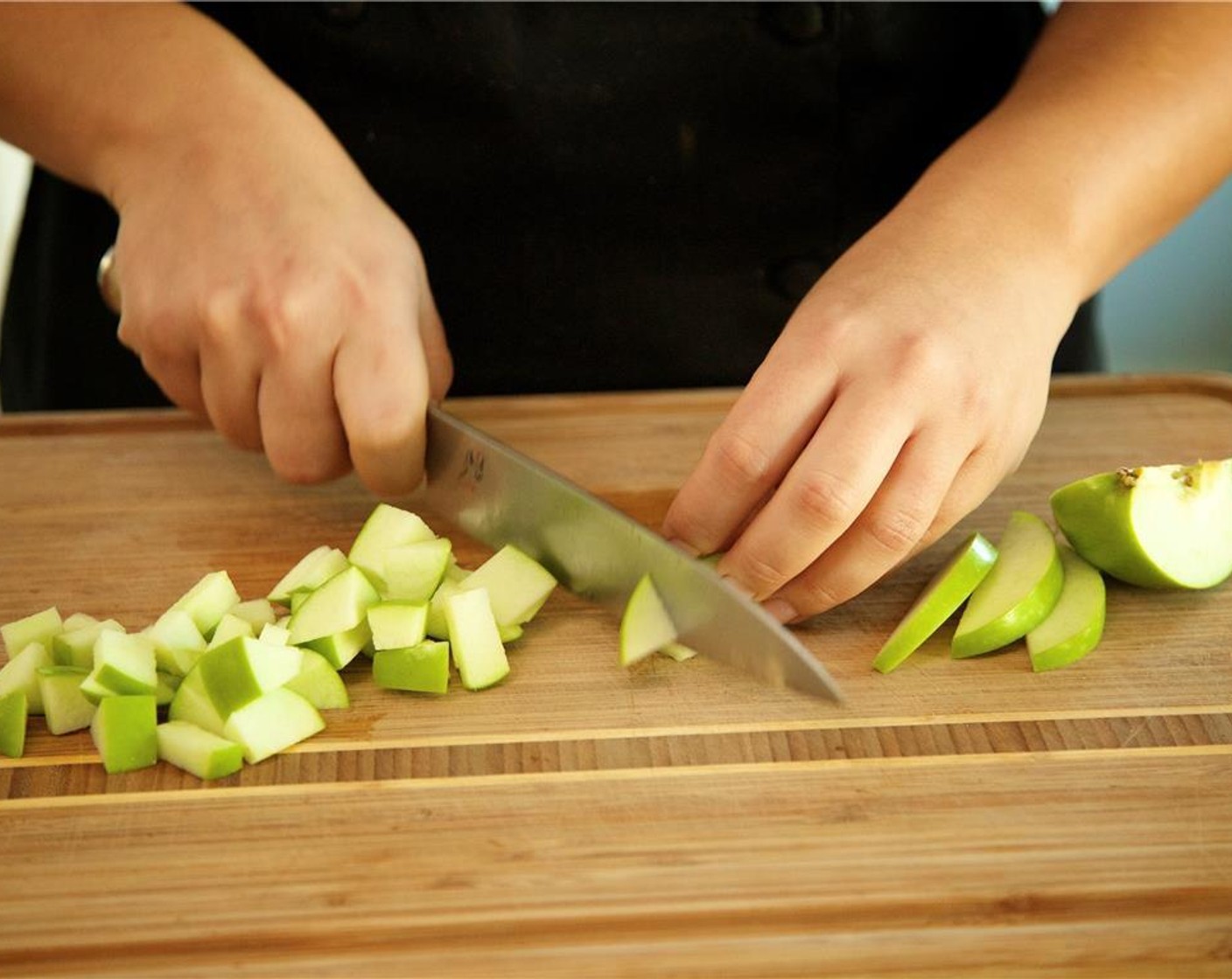 step 6 Slice Granny Smith Apple (1) into quarters, lay flat side on cutting board, and remove the core on each slice with your knife, cutting on a bias. Discard core. Dice apple into quarter inch small pieces.