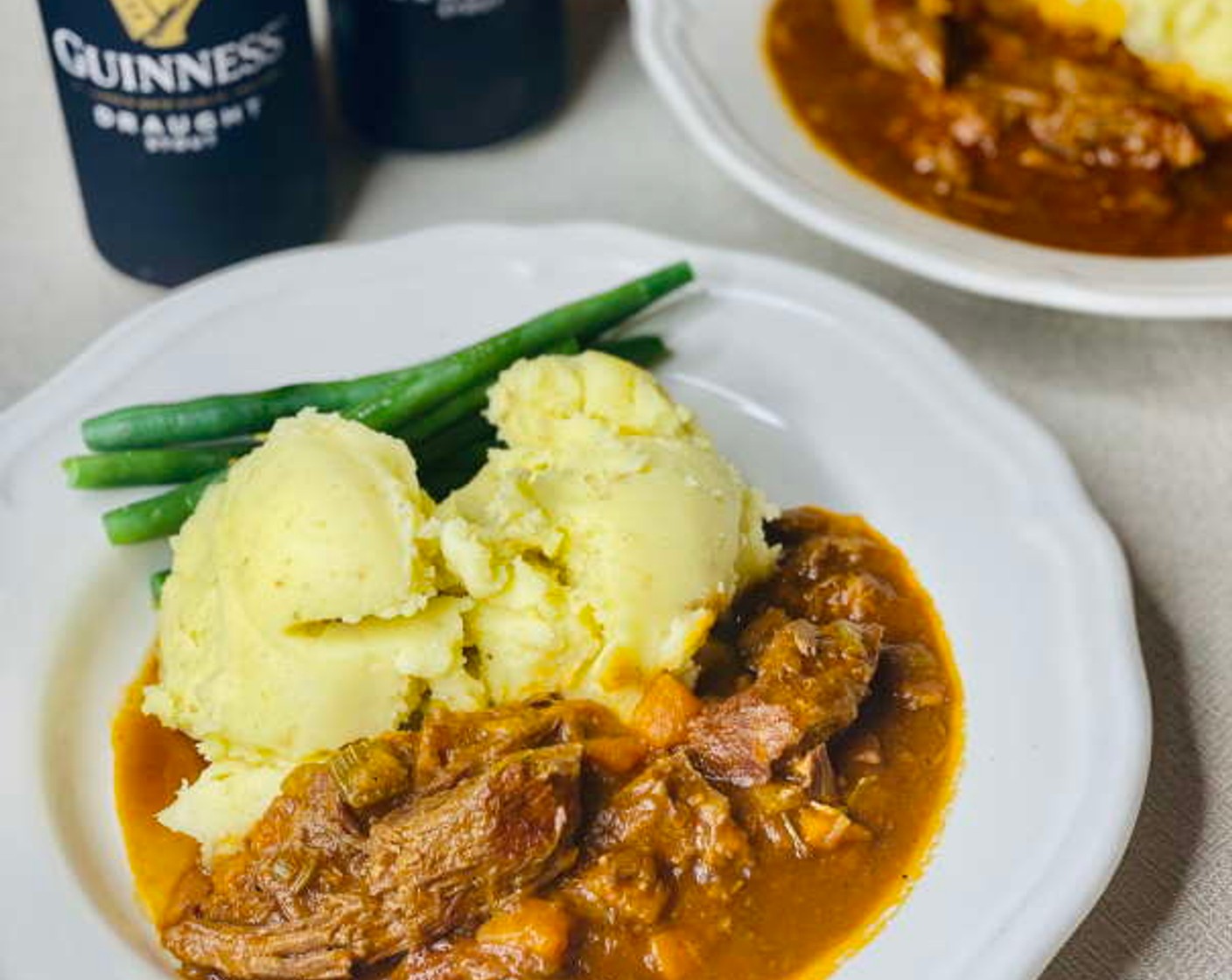 step 12 To serve, scoop some mashed potato onto serving plates and then spoon over or next to with the rich stew. You can also serve with steamed green beans or peas.