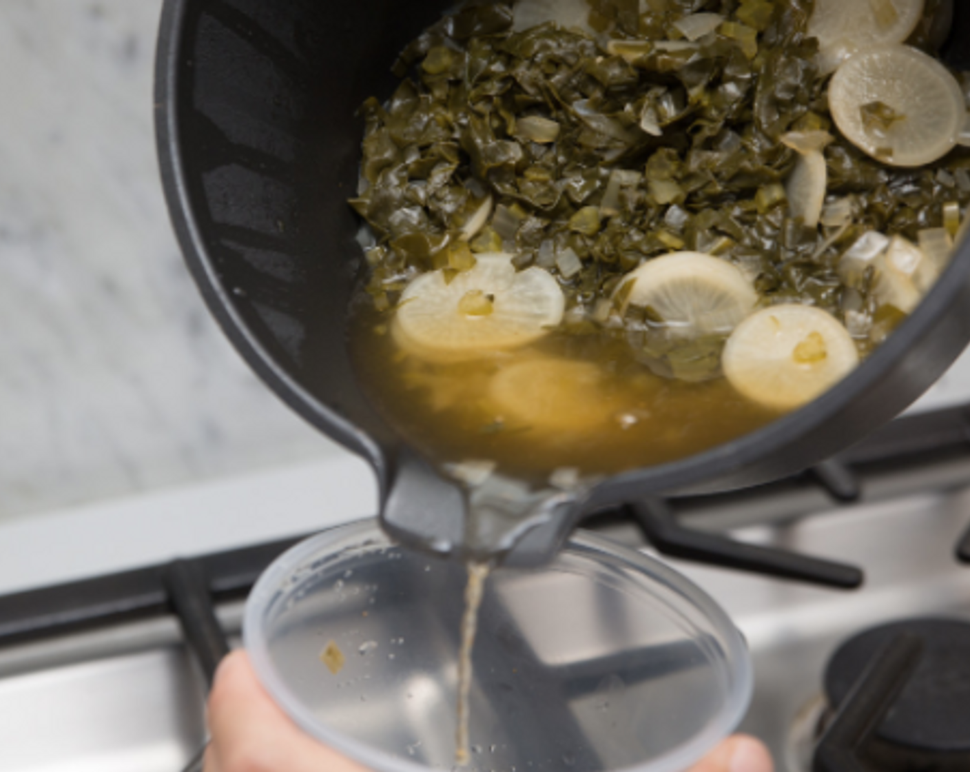 step 6 Taste and adjust seasoning; set aside. Remove and reserve 3/4 cup potlikker (cooking liquid), and combine in a small bowl with Liquid Aminos (1 pckg).