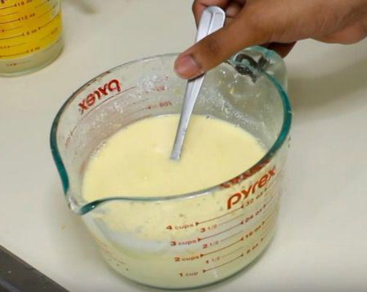 step 2 In a mixing jug, add Buttermilk (1 cup), Eggs (4), Vanilla Extract (1 tsp), and zest and juice of Lemons (3). Mix together.