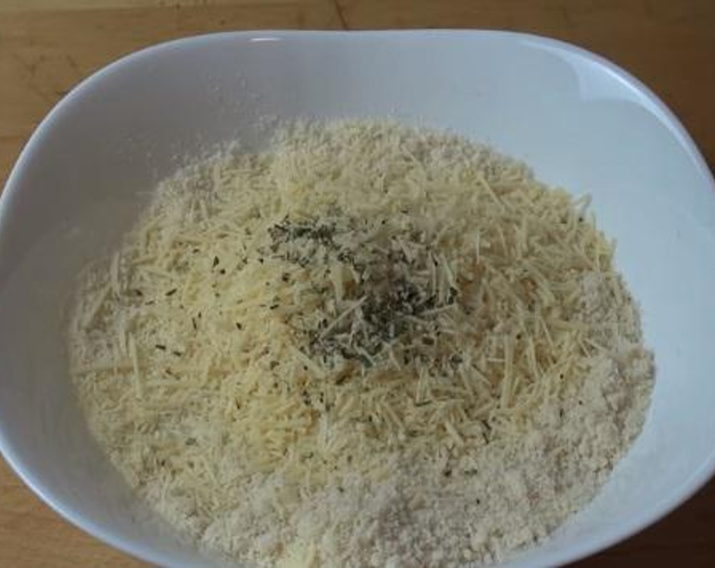 step 1 Into a bowl, add and mix the Breadcrumbs (3 cups), Grated Parmesan Cheese (1 cup), and Fresh Rosemary (1 Tbsp).