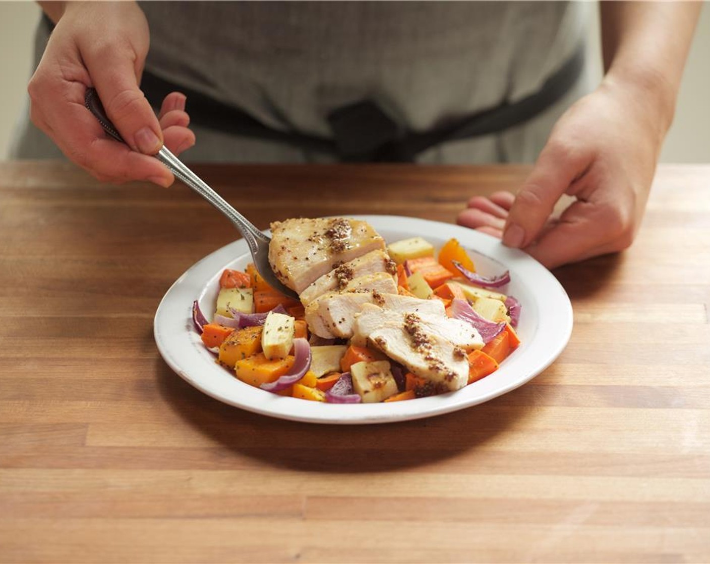 step 19 In the center of two plates, place chicken on top of roasted vegetables. Spoon sauce over the chicken.