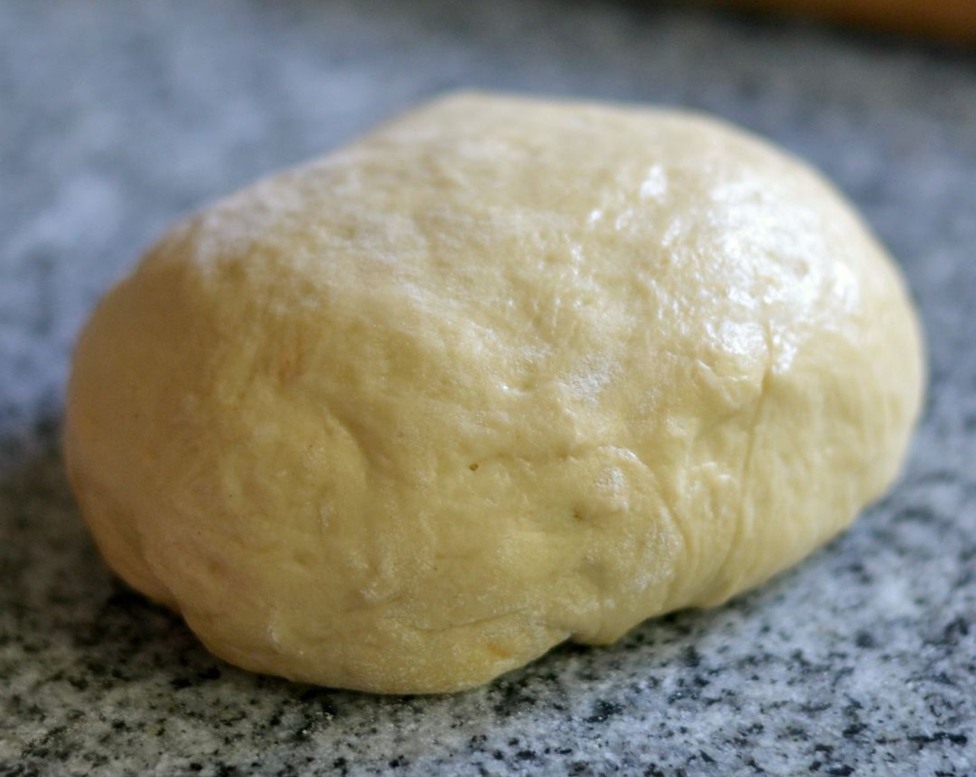 step 3 Knead until donut dough is smooth, elastic, and shiny. Cover it in an oiled bowl and let it rise for an hour in a warm place.