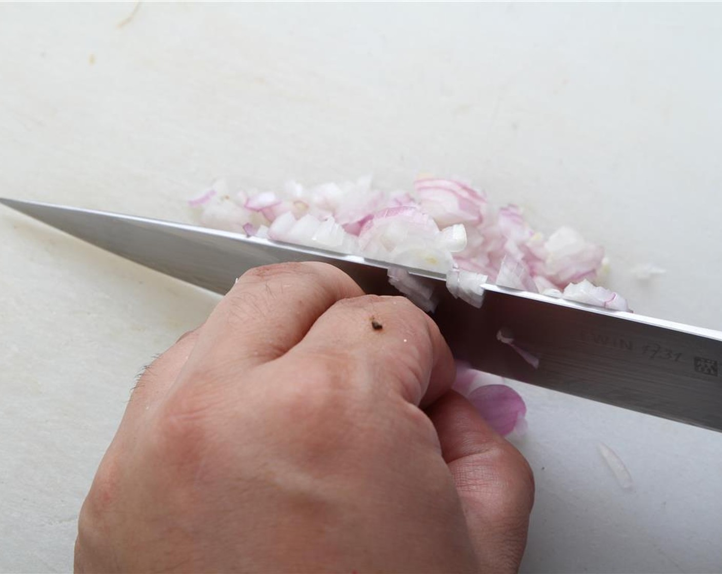 step 7 For the butter sauce, finely dice the Shallots (5).