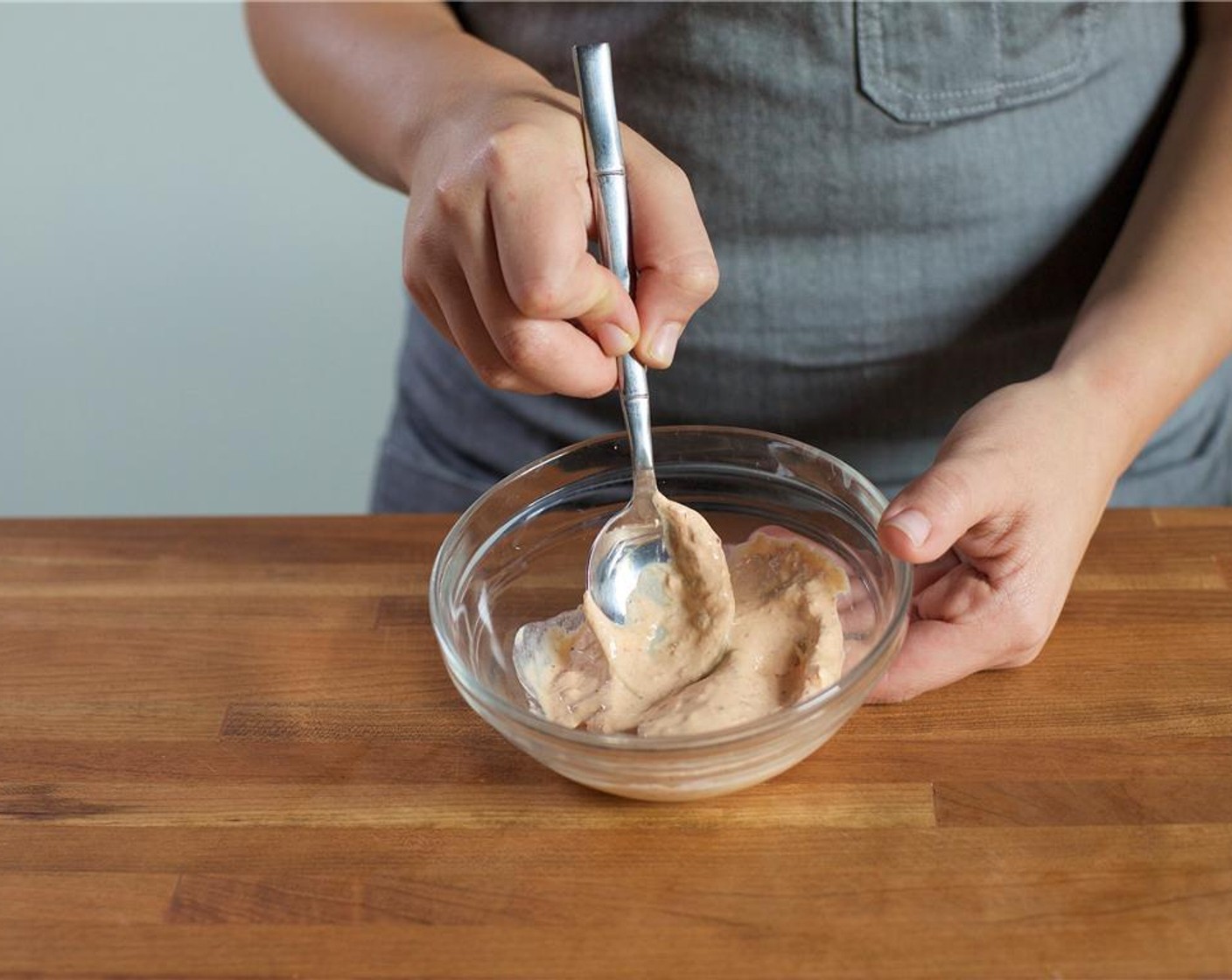 step 5 In a second small bowl, combine Sour Cream (2 Tbsp), Chipotle Chili Puree (1 Tbsp), half of the lime juice, Salt (1/4 tsp), and Ground Black Pepper (1/4 tsp). Stir to combine and set aside.