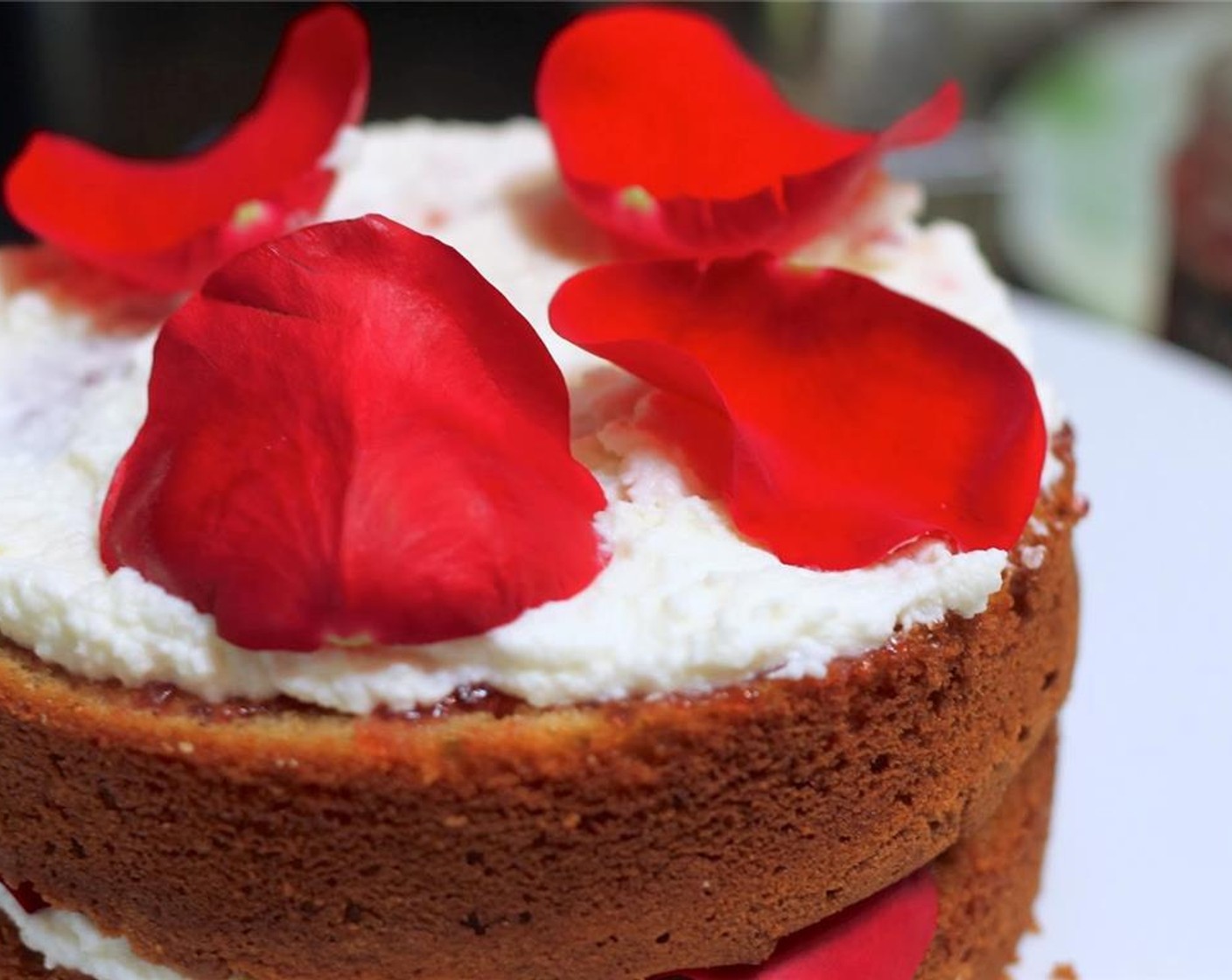 step 12 Then a dollop of Rosewater Whipped Cream and spread over the top of the jam. Add rinsed and dried Edible Dried Rose Petals (to taste).