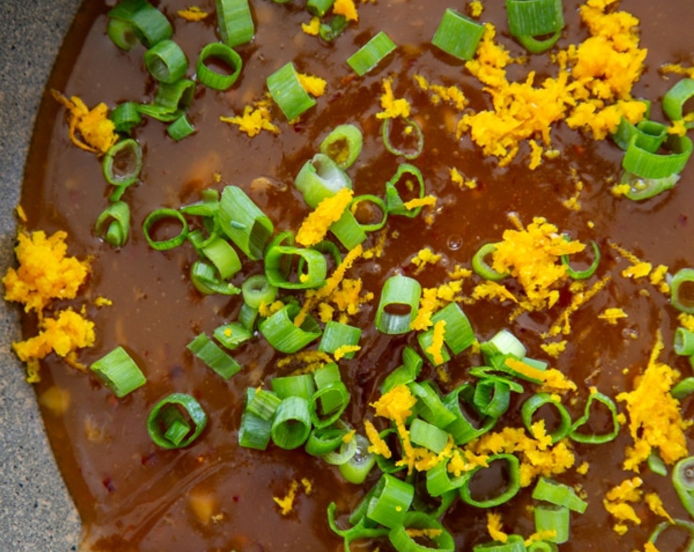 step 6 Add the cornstarch slurry and whisk in, cooking for 5 minutes or until thickened. Remove from heat and stir in the Scallion (1/4 cup) and Orange Zest.