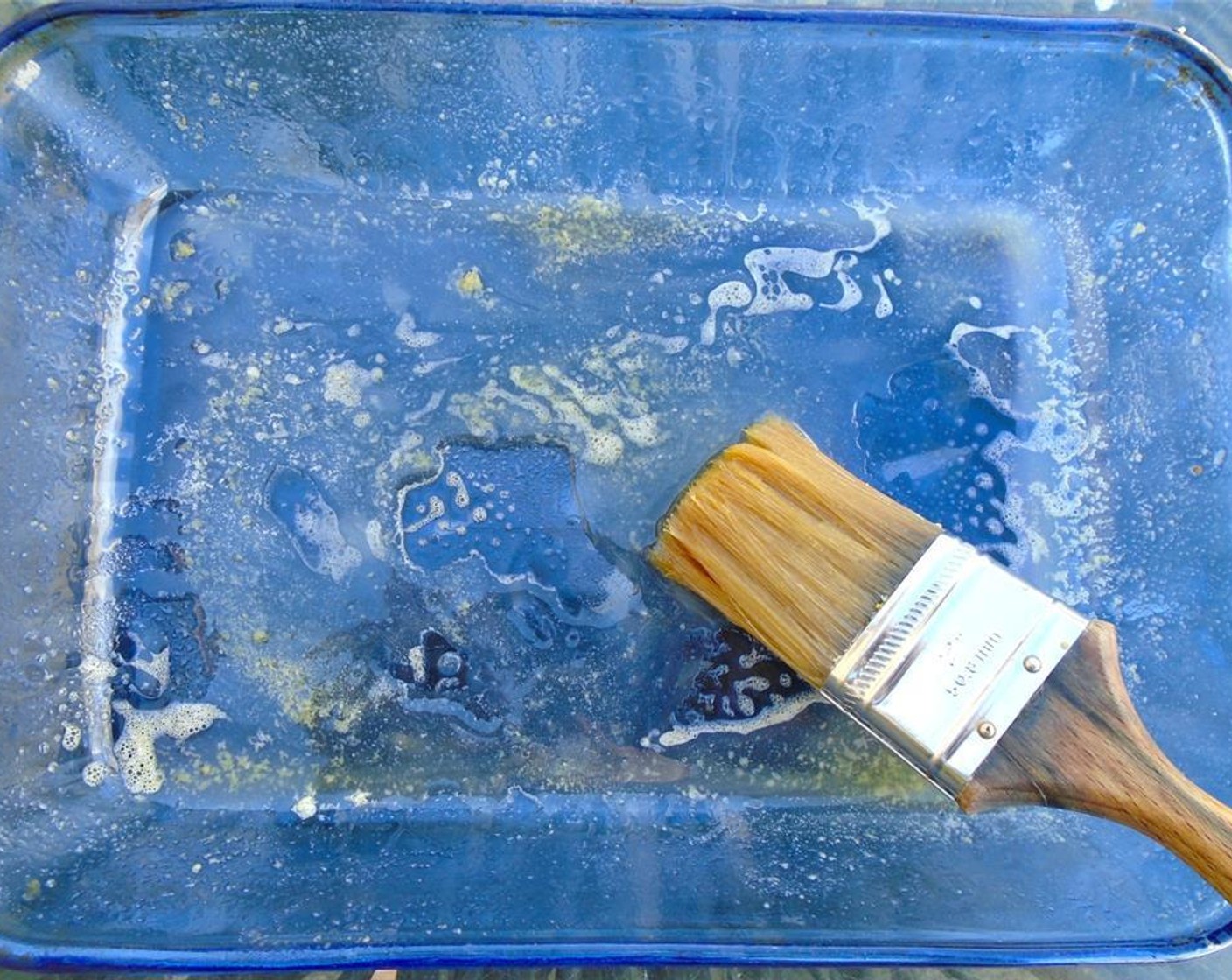 step 5 Coat a baking dish with Garlic Paste (to taste) and Garlic Oil (as needed).