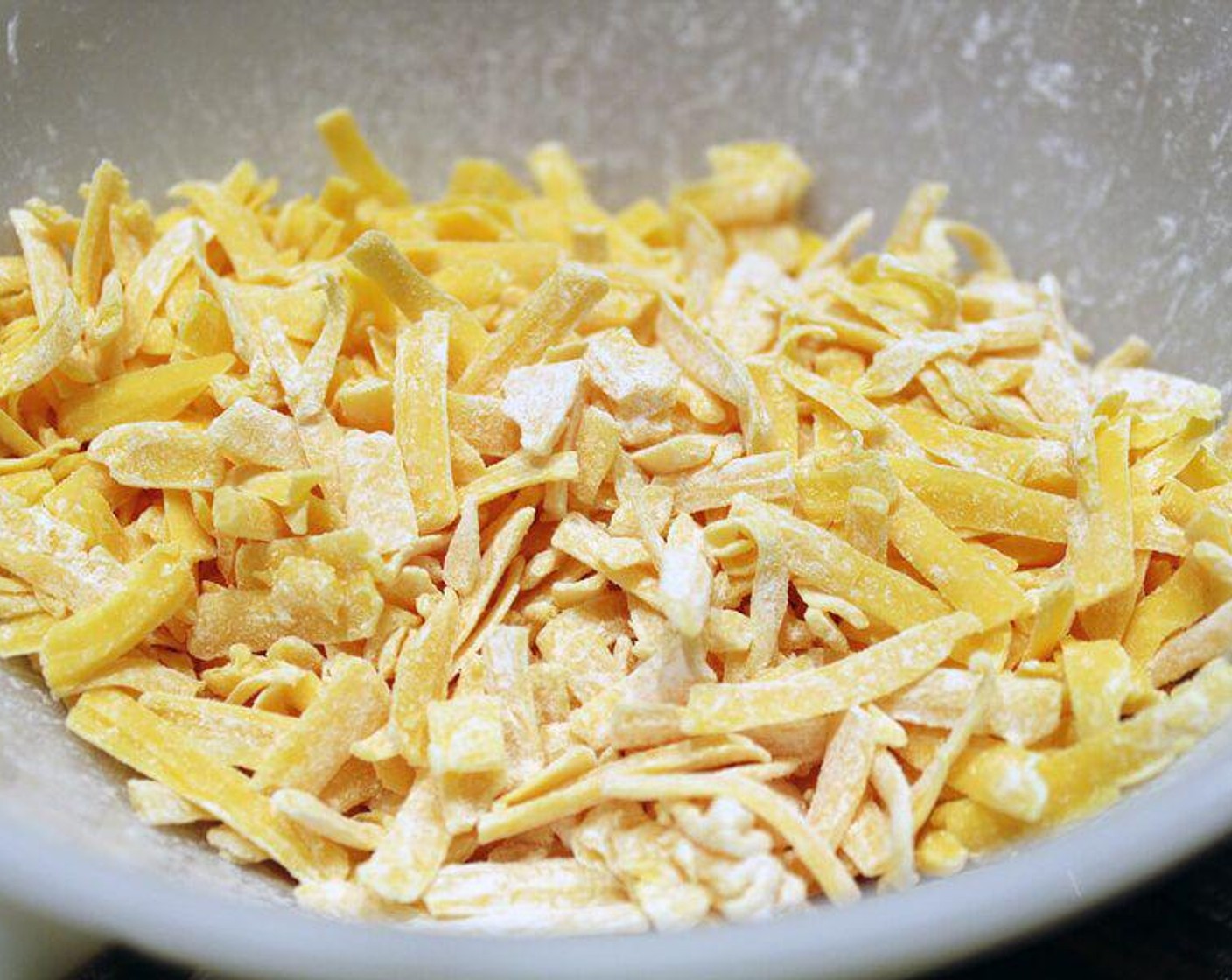 step 2 In a medium sized bowl, toss cheese with Corn Starch (1 Tbsp). Toss until well coated.