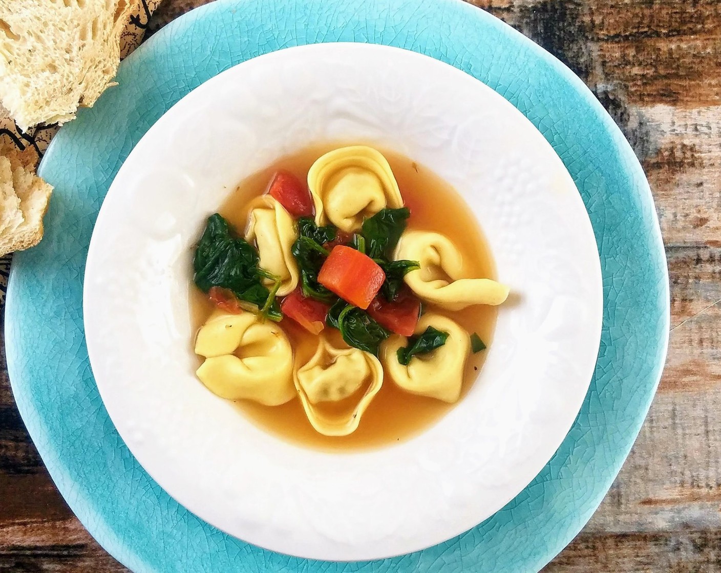 Tortellini En Brodo with Spinach and Tomatoes