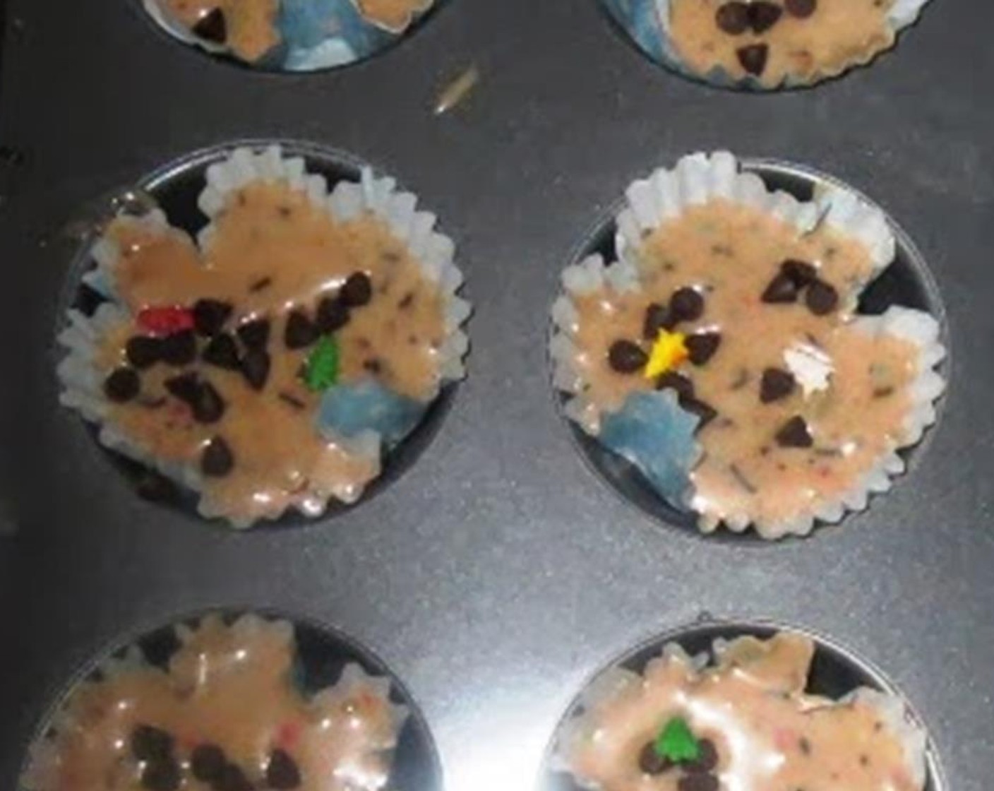 step 6 Fill 3/4 of each cupcake mold with the batter. Also sprinkle some more chocolate chips on the top of the batter.