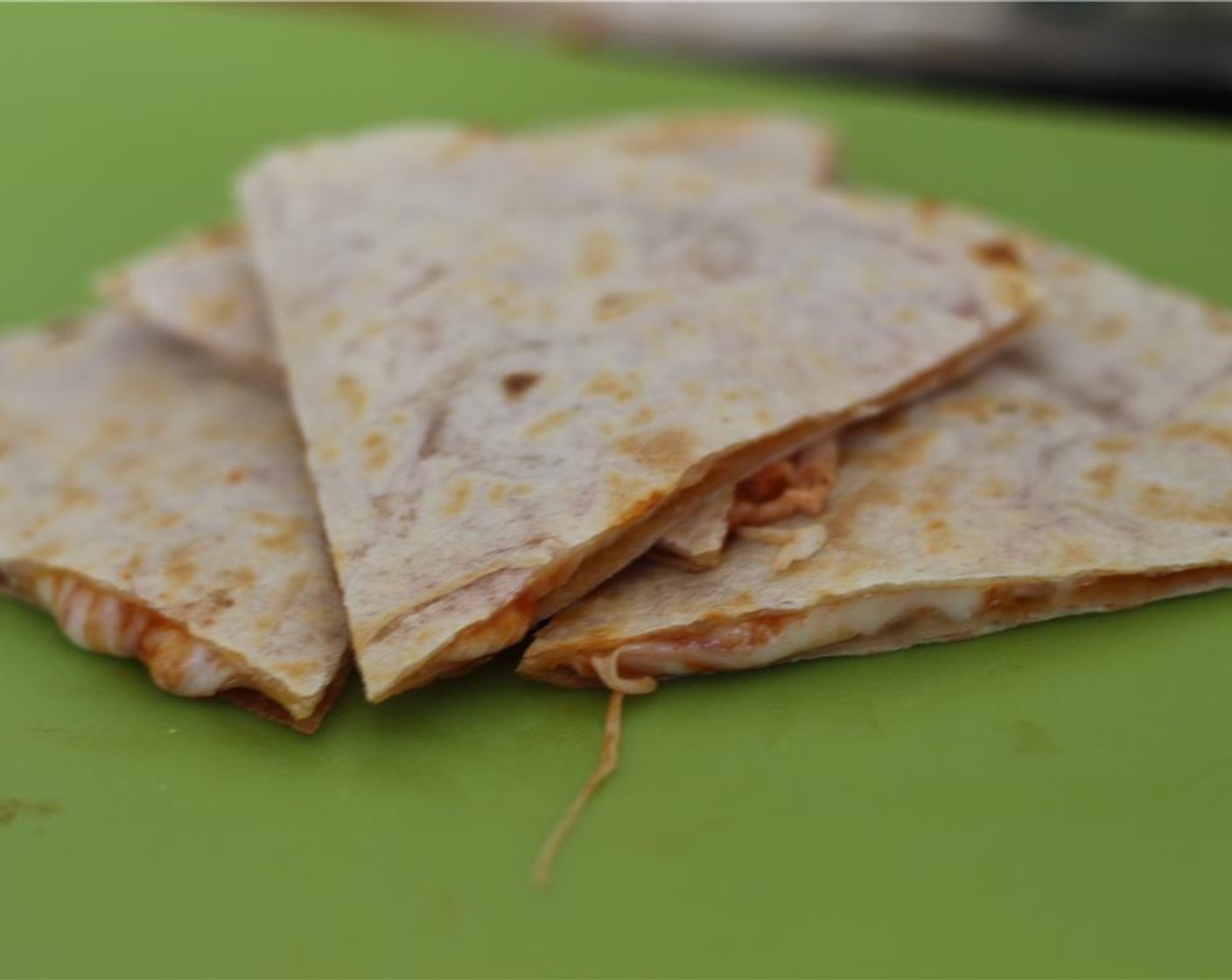 step 4 Remove from the heat and allow to cool for a bit. After they have sufficiently cooled, grab a knife and slice! Now you effectively have a quesadilla of pizza and a whole lot of happy, drunkish people.