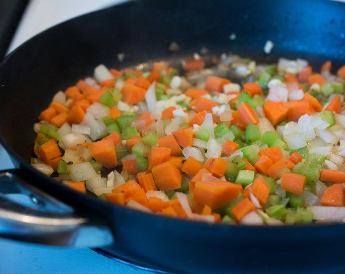 step 2 Saute the Carrot (1 cup), Celery (1 cup), White Onion (1 cup) and Garlic (4 cloves) in Butter (2 Tbsp) under medium heat for about 5 minutes.