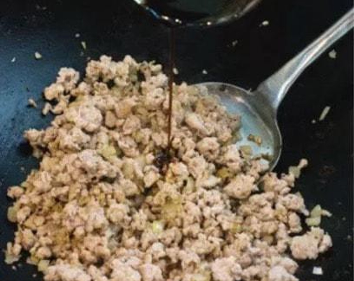 step 5 Add the Ground Pork (1 lb) to the wok and stir-fry until no longer pink. Return the onion and garlic mixture to the wok. When ground pork has cooked all the way through, stir in the sauce and mix well until the ground pork is thoroughly coated in the sauce.