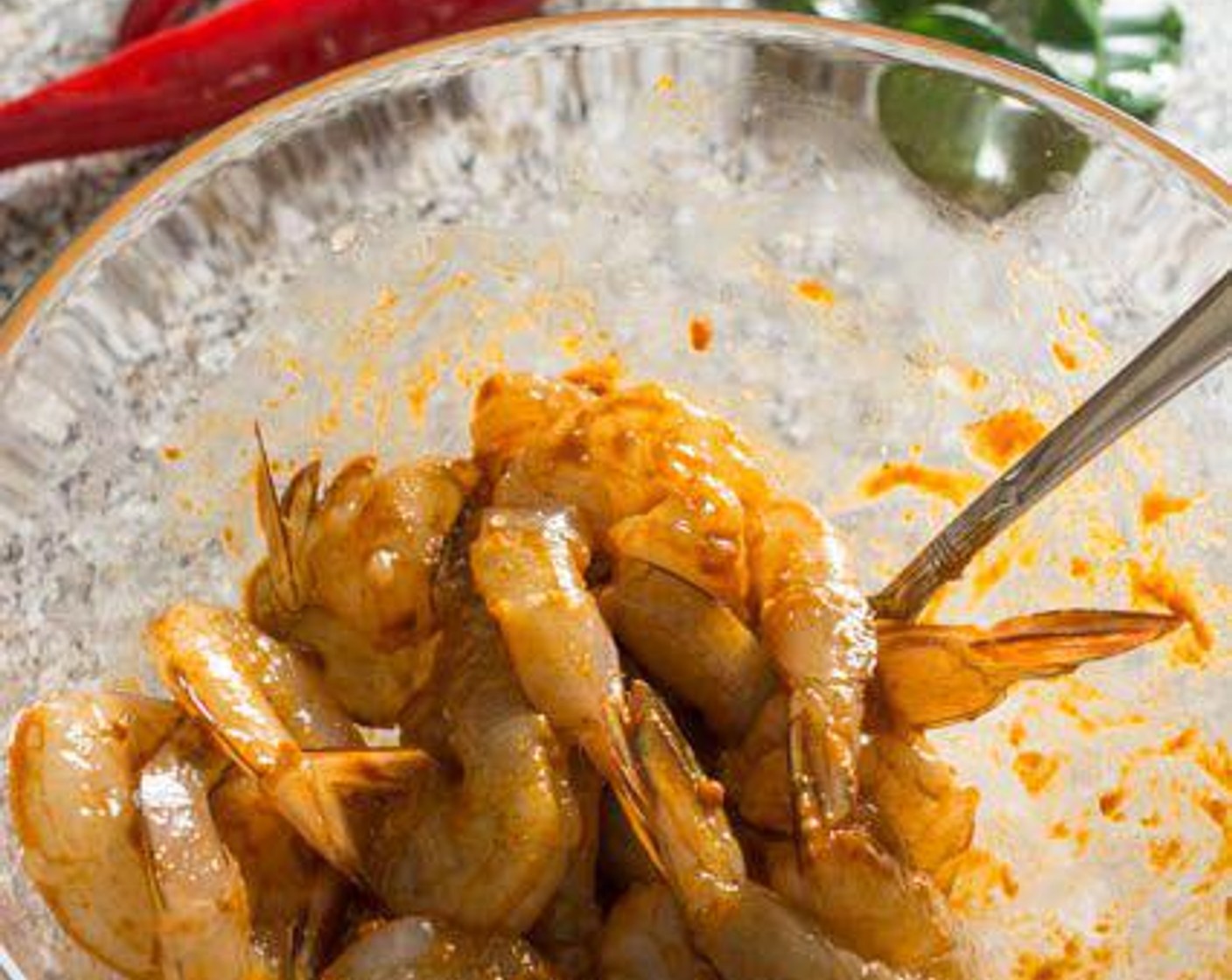 step 2 Stir well, coating every shrimp evenly with the Tom Yum paste. Allow the shrimp to marinate in the fridge for 15 - 30 minutes.