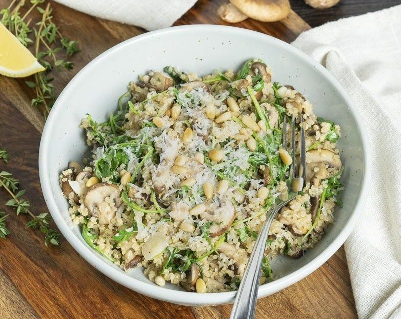 step 7 Divide into 2 bowls and top with Parmesan Cheese (to taste) and Pine Nuts (1/4 cup).