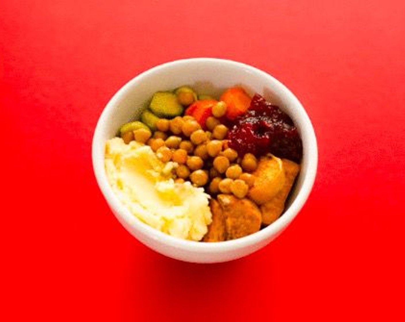 step 9 To assemble, spoon mashed potatoes into the bottom of 2 or 3 serving bowls. Top equally with each of the veggies, adding more mashed potatoes on top if you’d like. Spoon on a dollop of Cranberry Sauce (1/2 cup).
