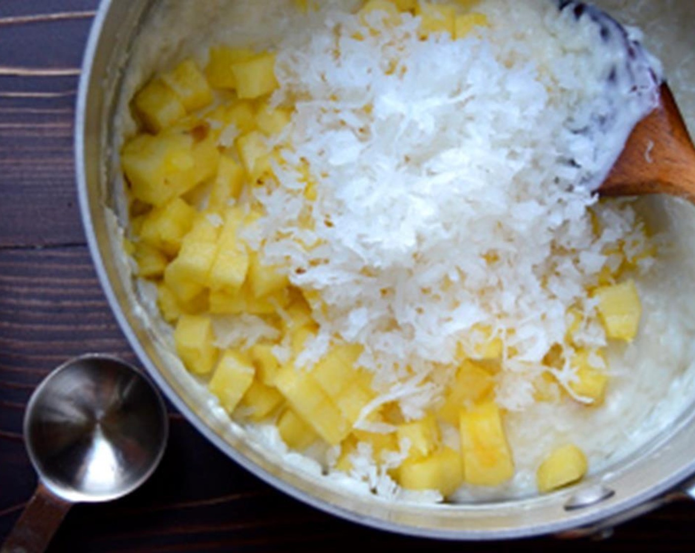 step 3 Stir in the Dark Rum (1 Tbsp), Coconut Extract (1/2 tsp), Sweetened Coconut Flakes (1/2 cup), and Pineapple (1 cup) that has been cut into a 1/4" dices.